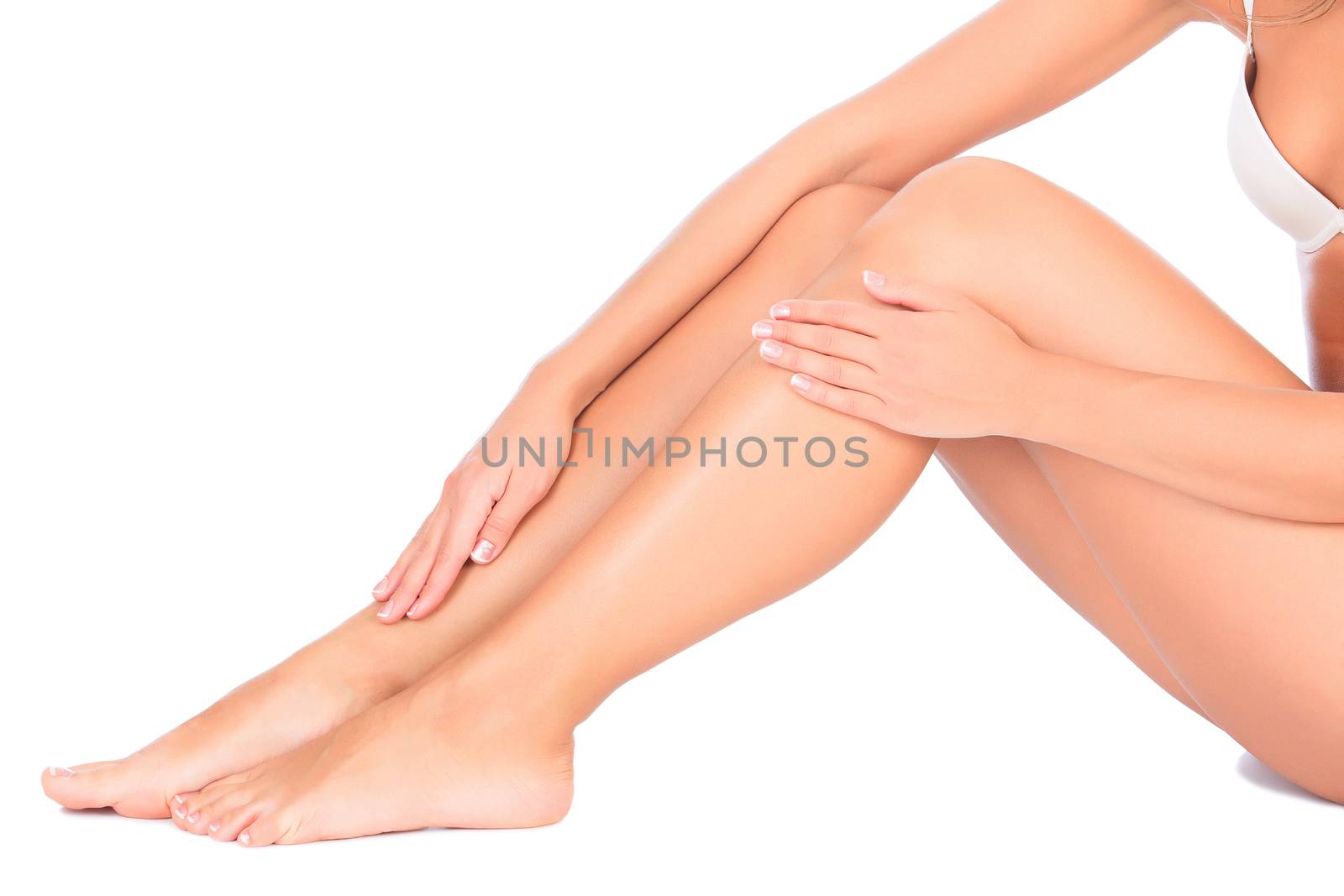 Female legs and hands, white background