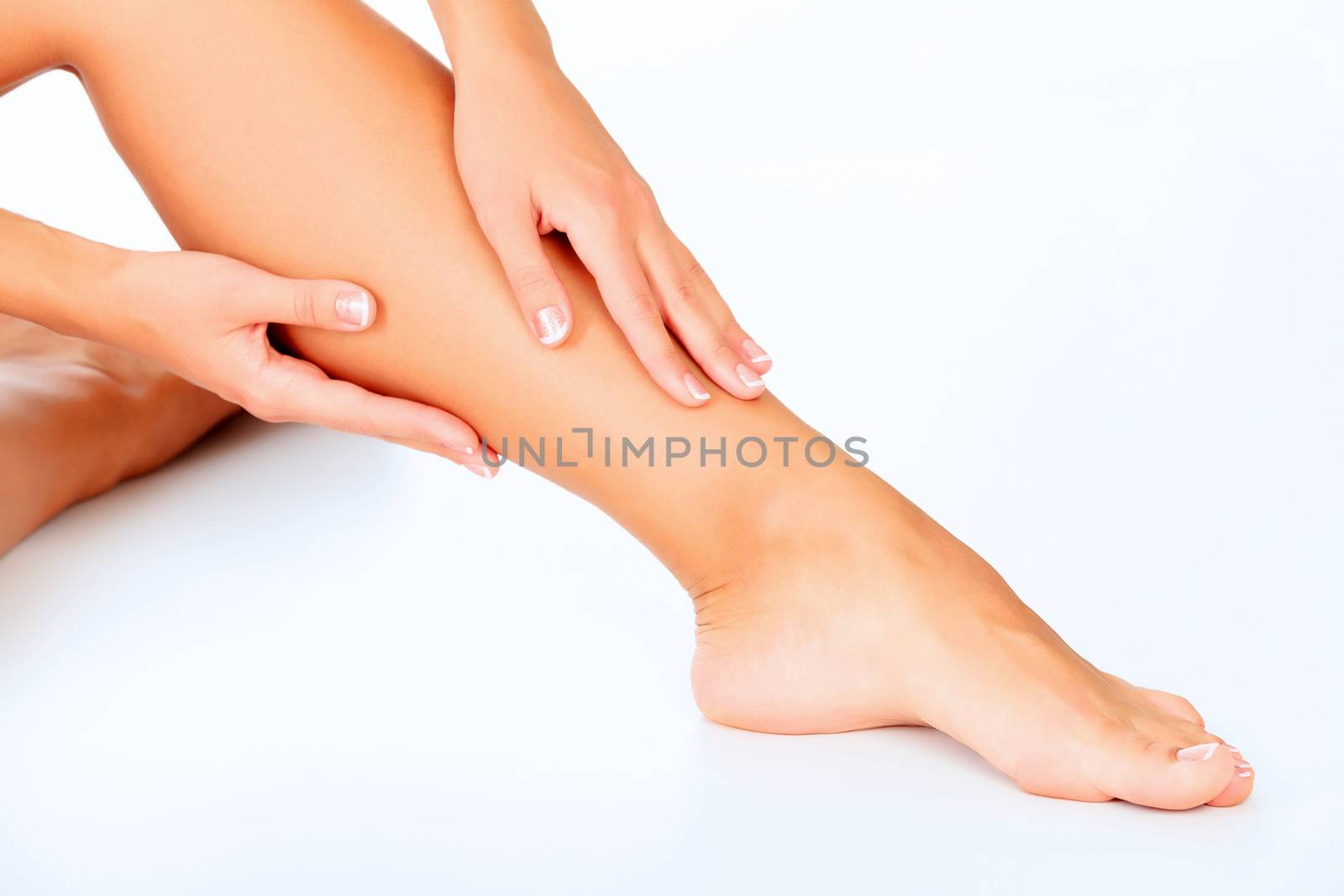 Female legs and hands, white background