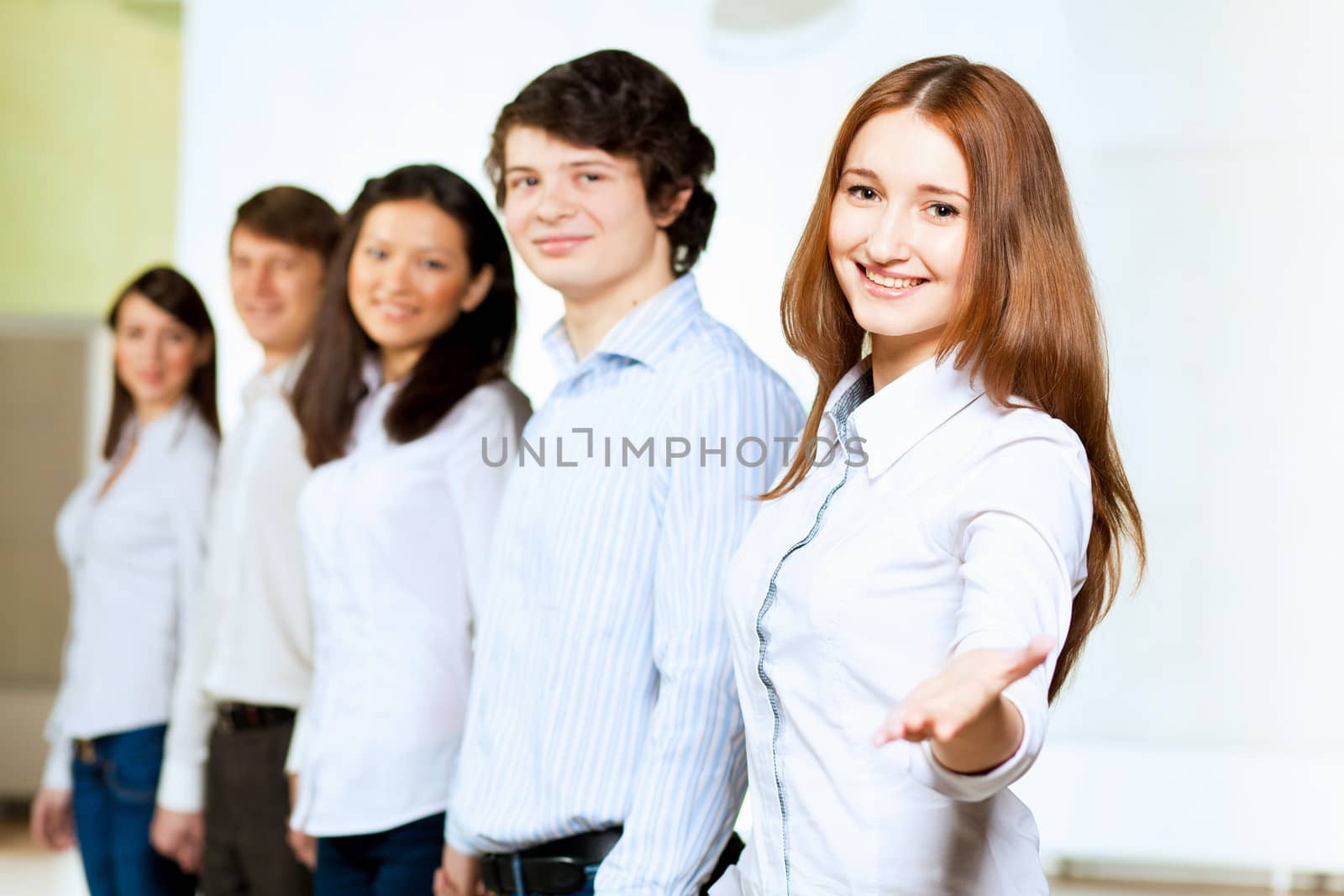 Image of five students in casual wear standing in row