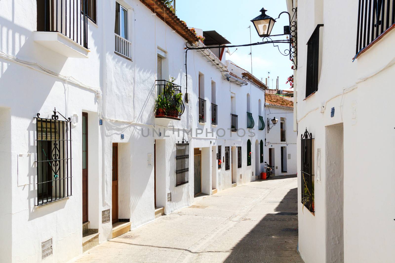 Beautiful street with flowers in the Mijas town, Spain