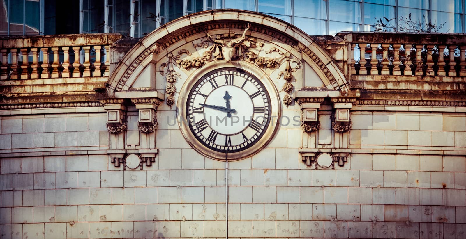 Victorian clock face on London Bridge station c1856, with deer and fruit decoration