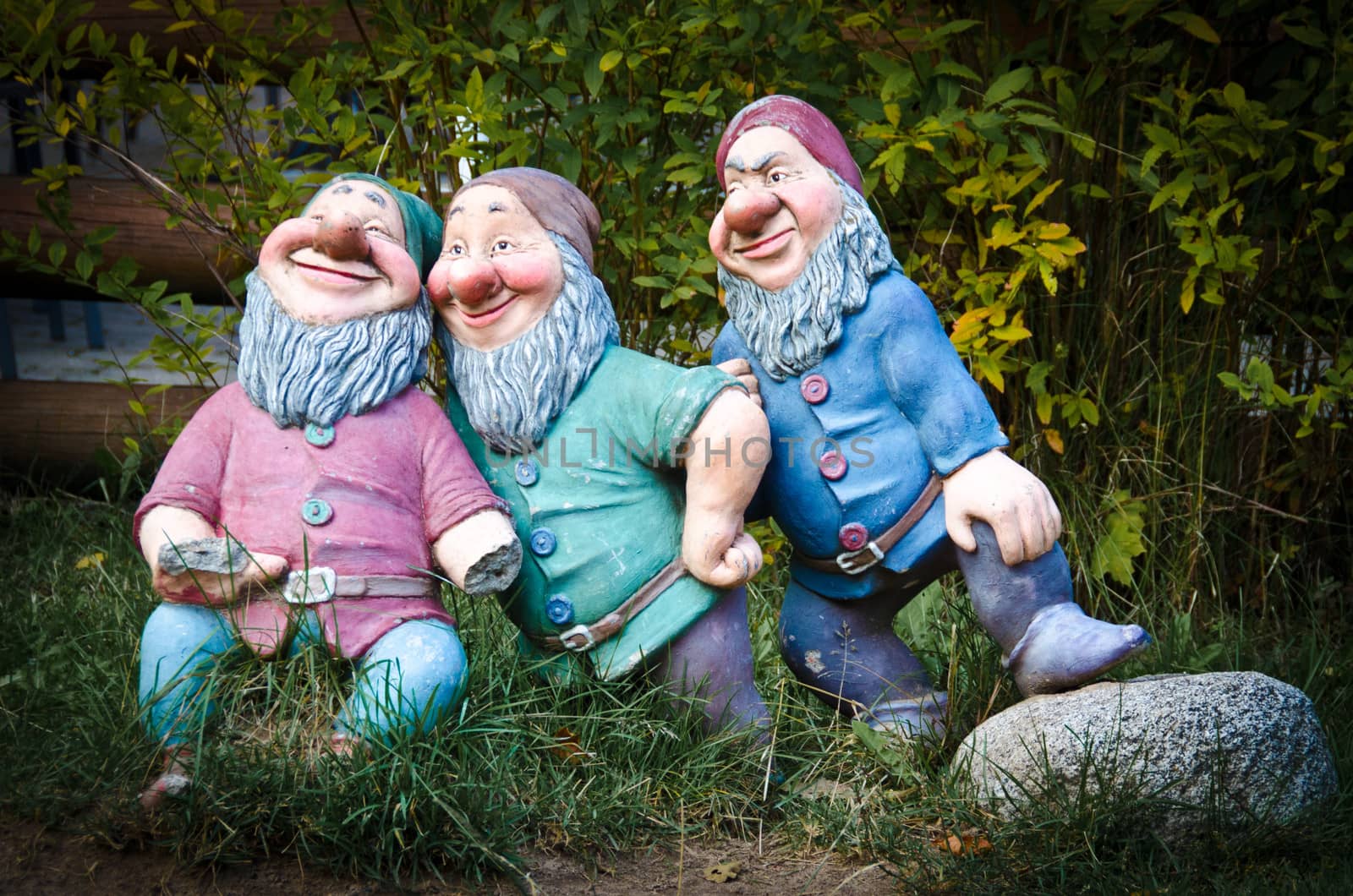 Three colourful garden gnomes