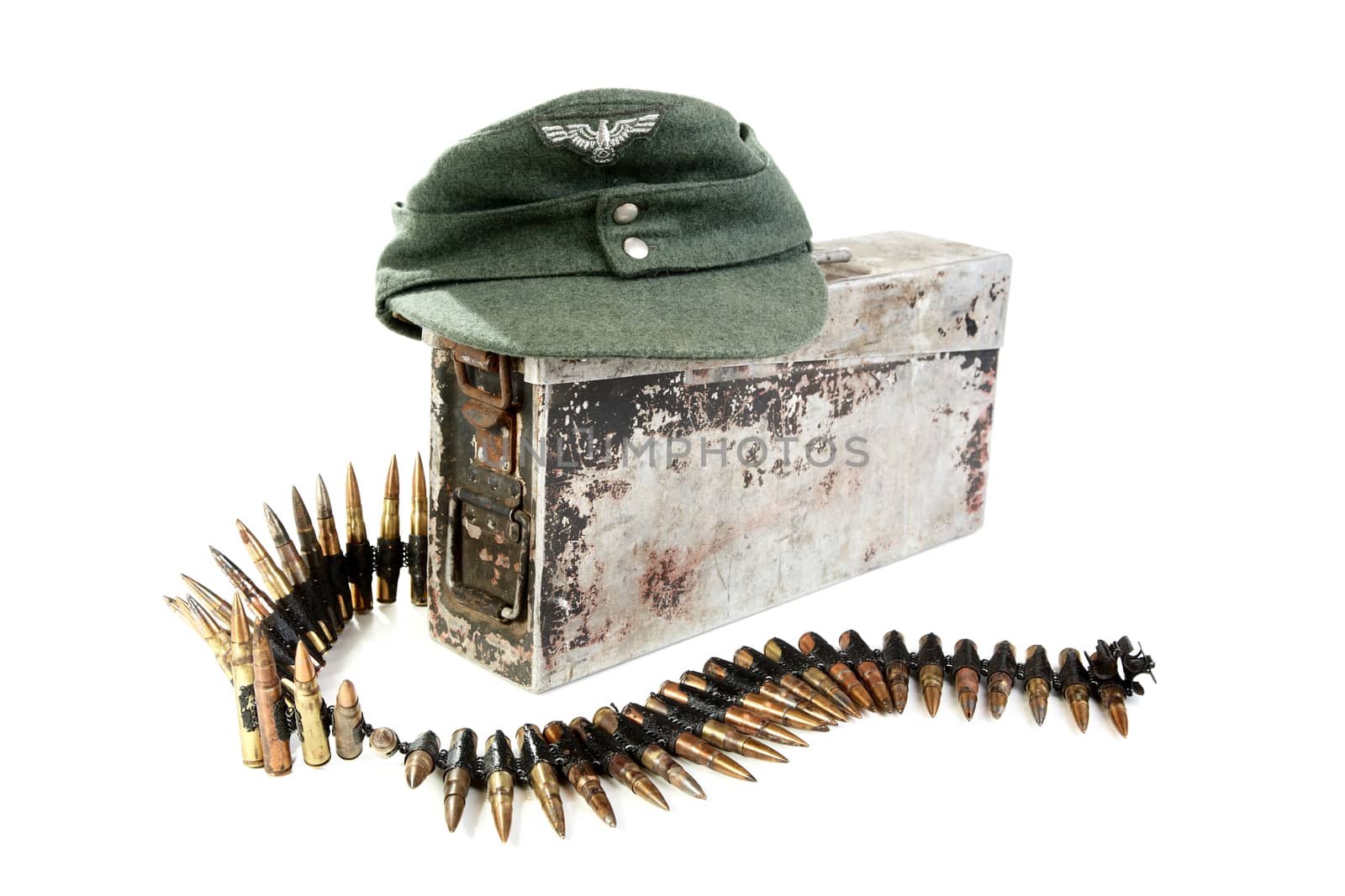 Kepi of the German soldier and machine-gun tape on a white background