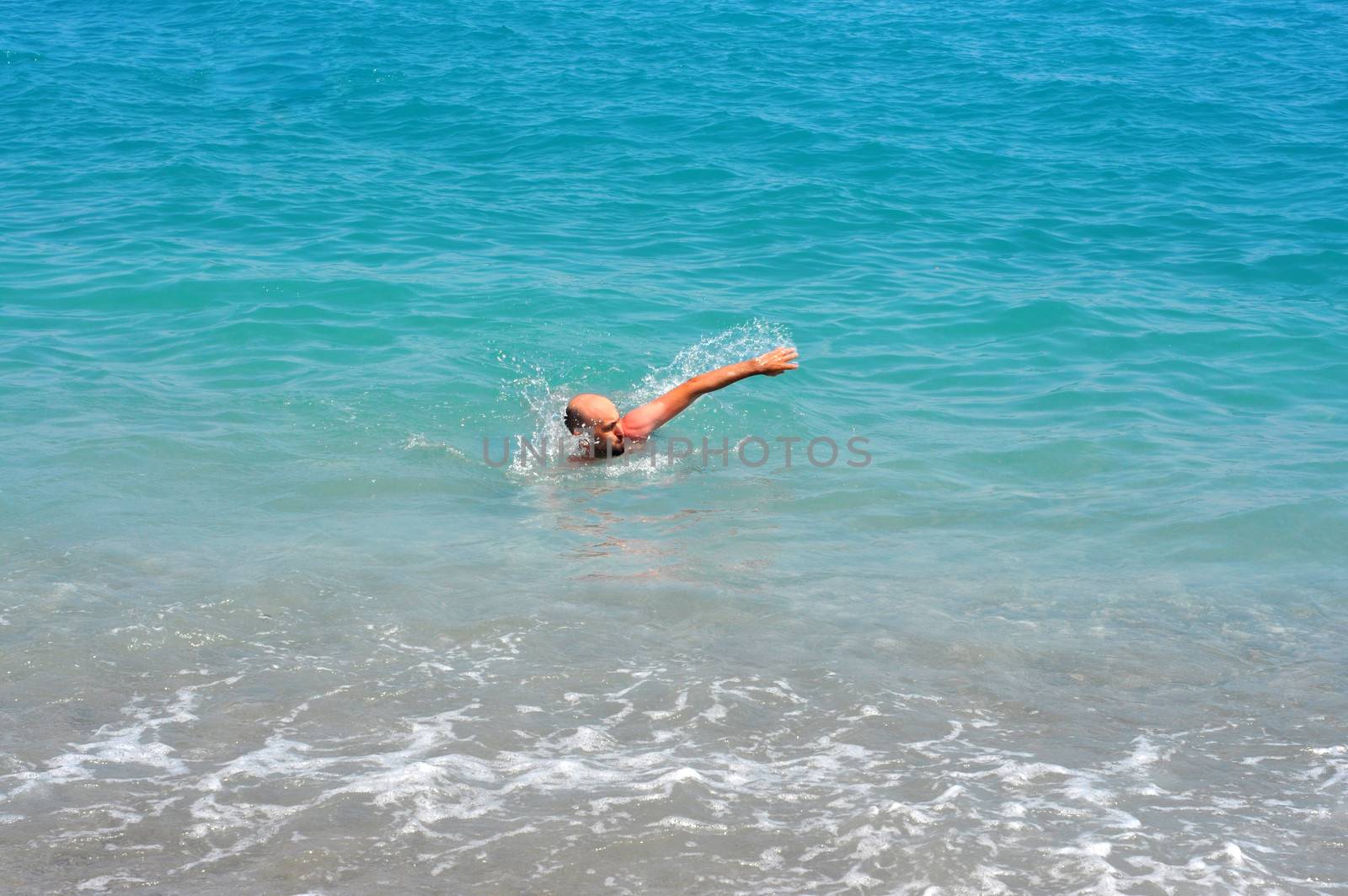 man swimming  by tony4urban