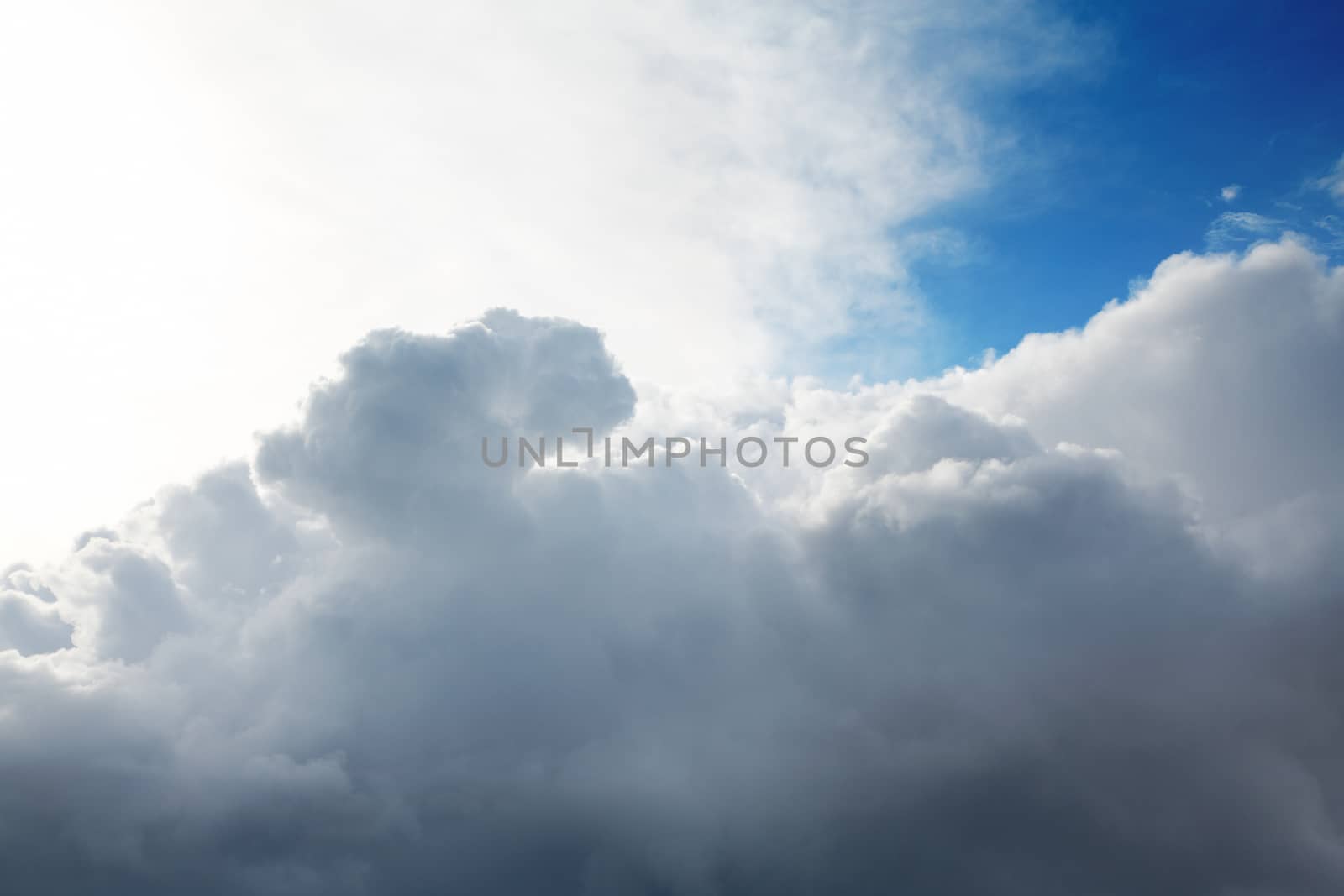 Cumulus clouds and the dark blue sky