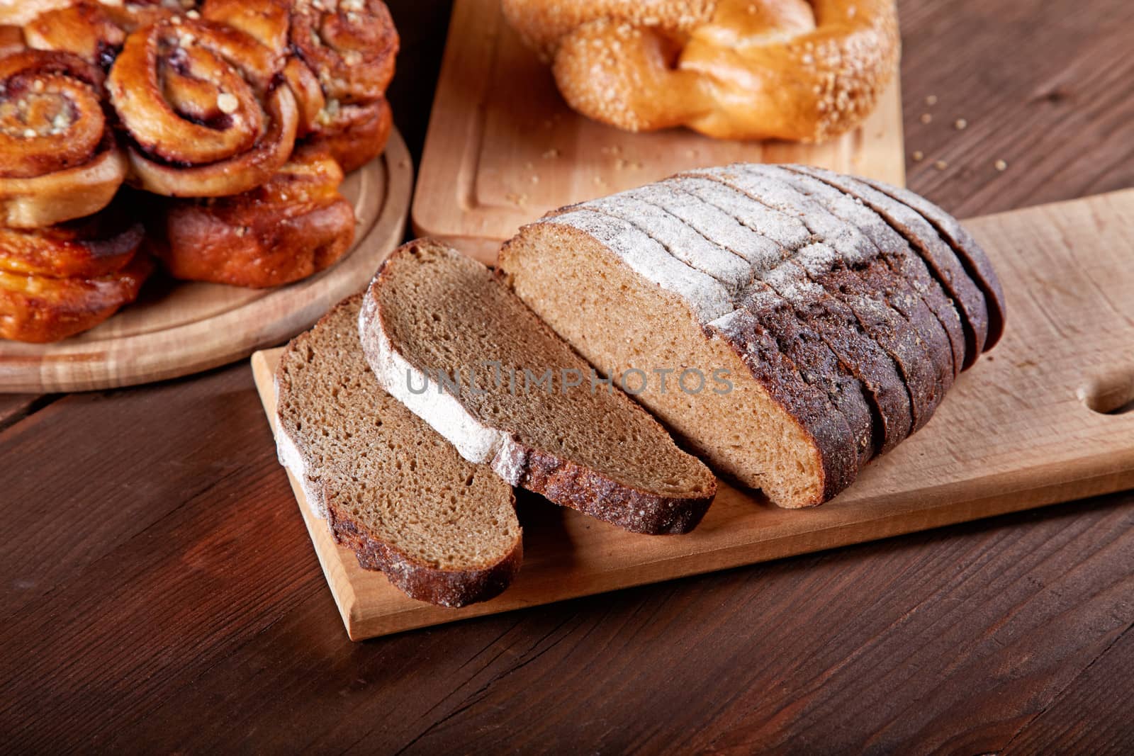 Still-life with the cut bread and rolls