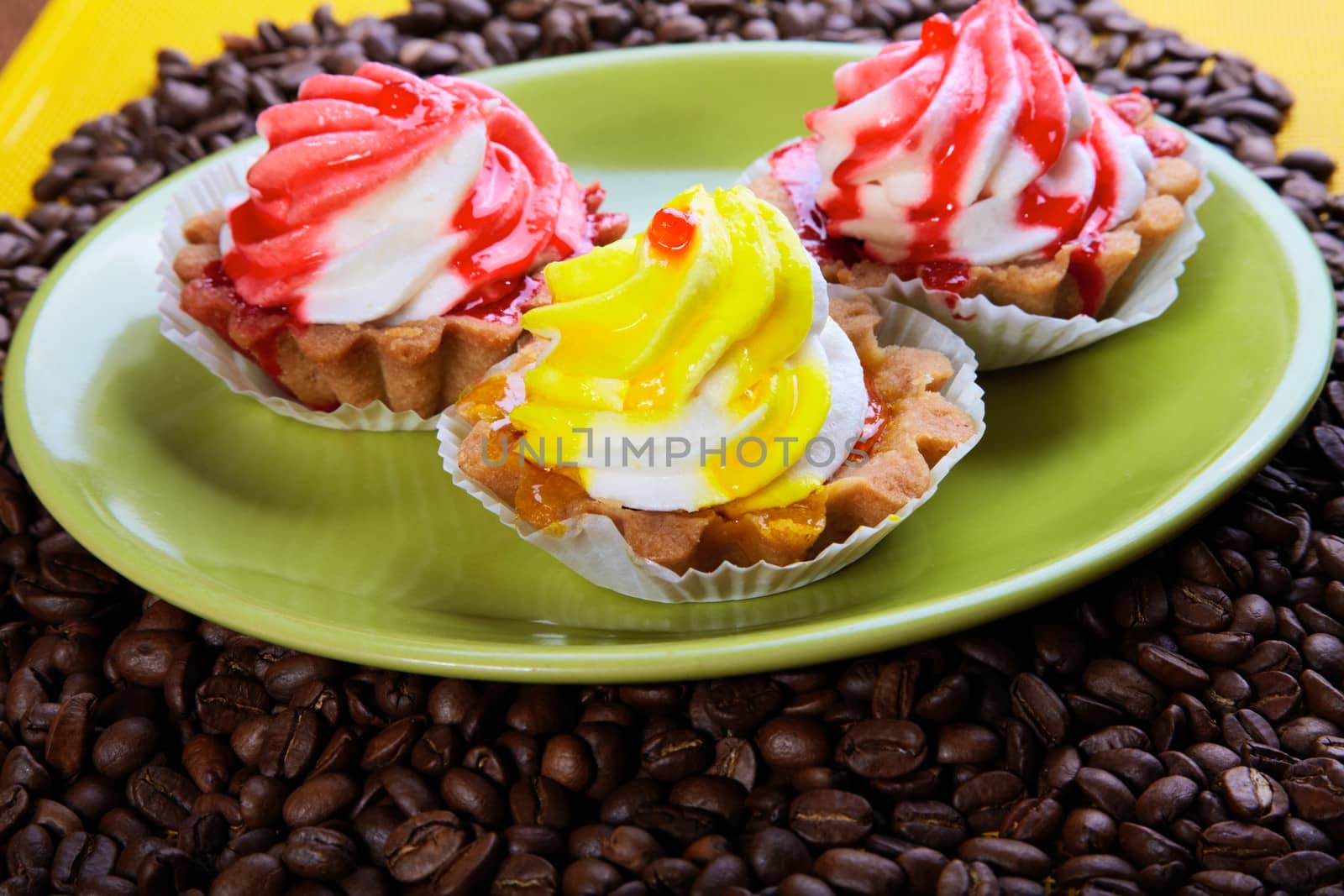 Cakes on a plate with coffee grains