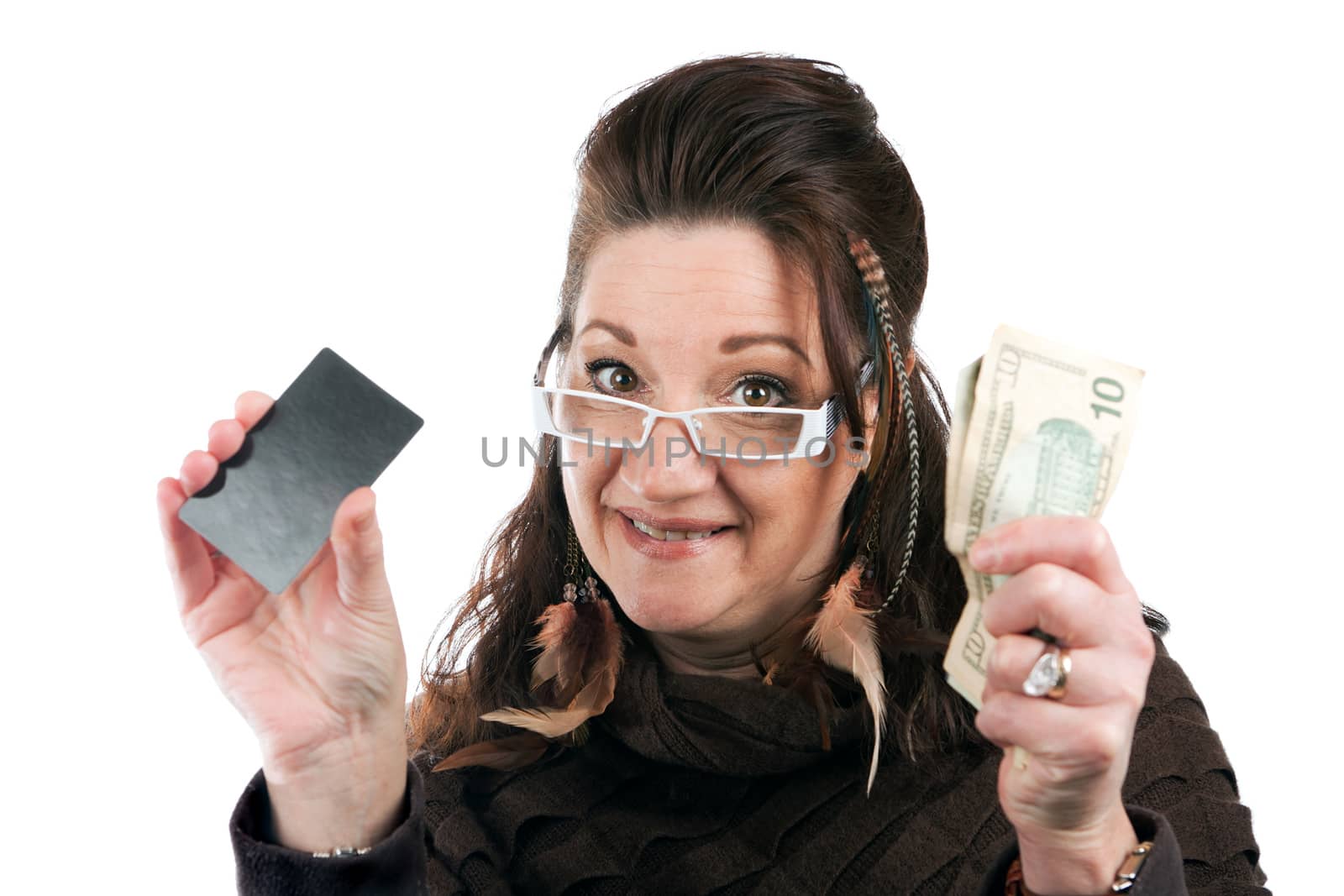 Brunette woman holding up a blank credit card business card shoppers club card or gift card of some sort along with some cash in her other hand.