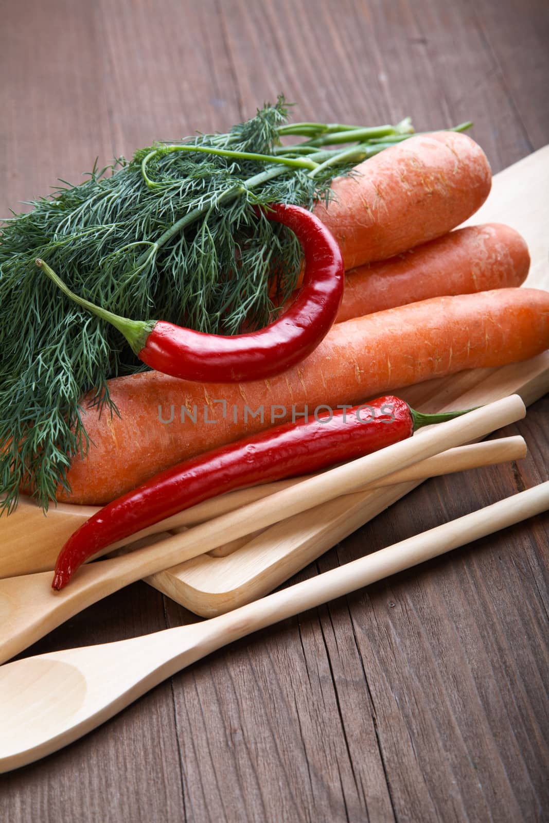 Spices and vegetables on an old wooden table