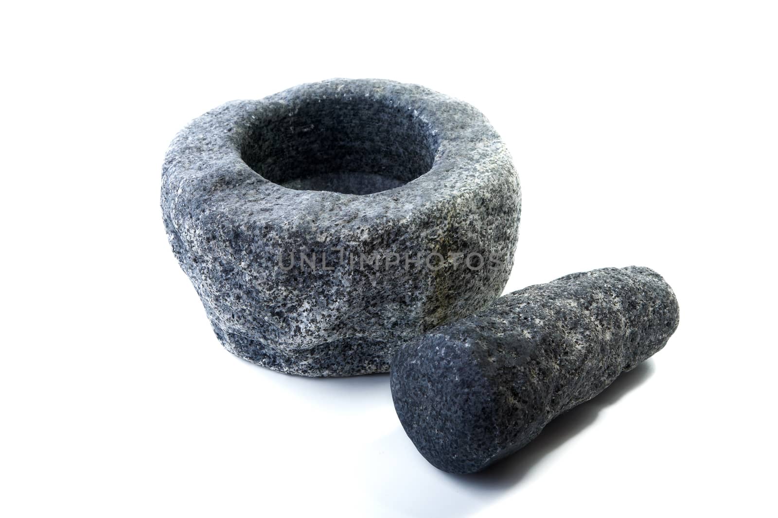 Granite mortar and pestle isolated on a white background