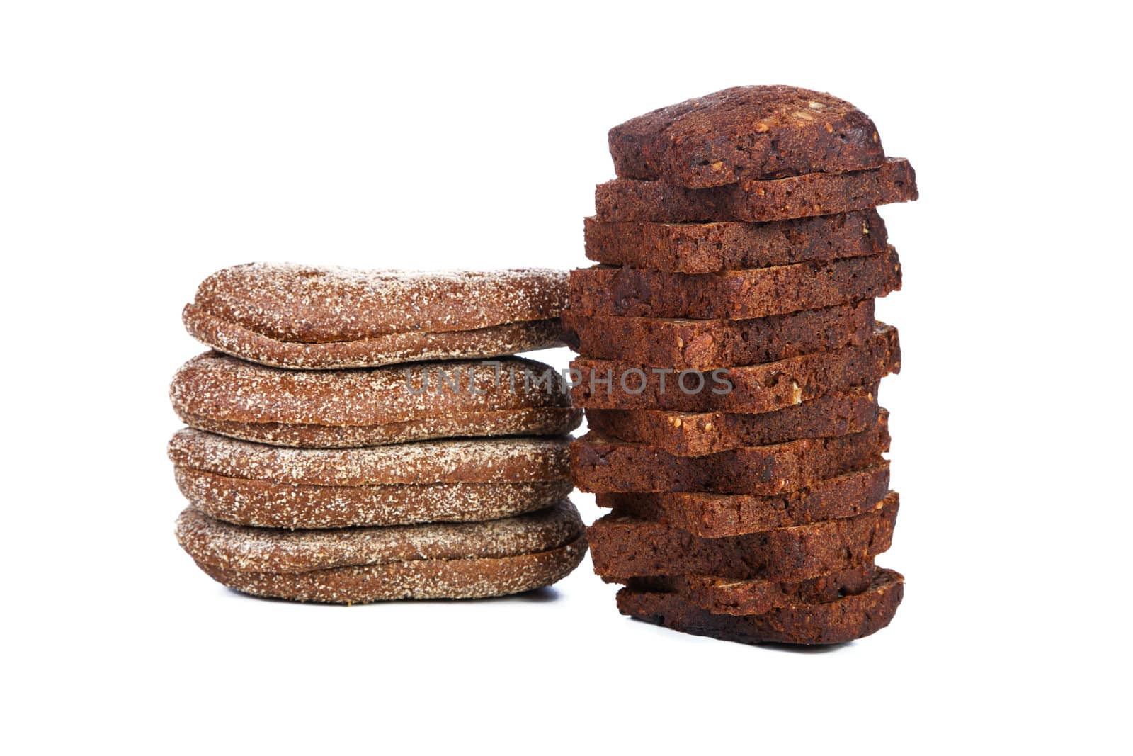 Two piles of slices  black bread isolated on a white background