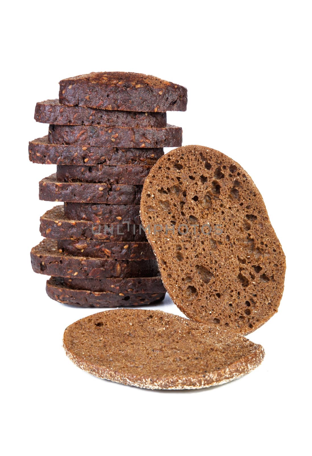 Two piles of slices  black bread isolated on a white background