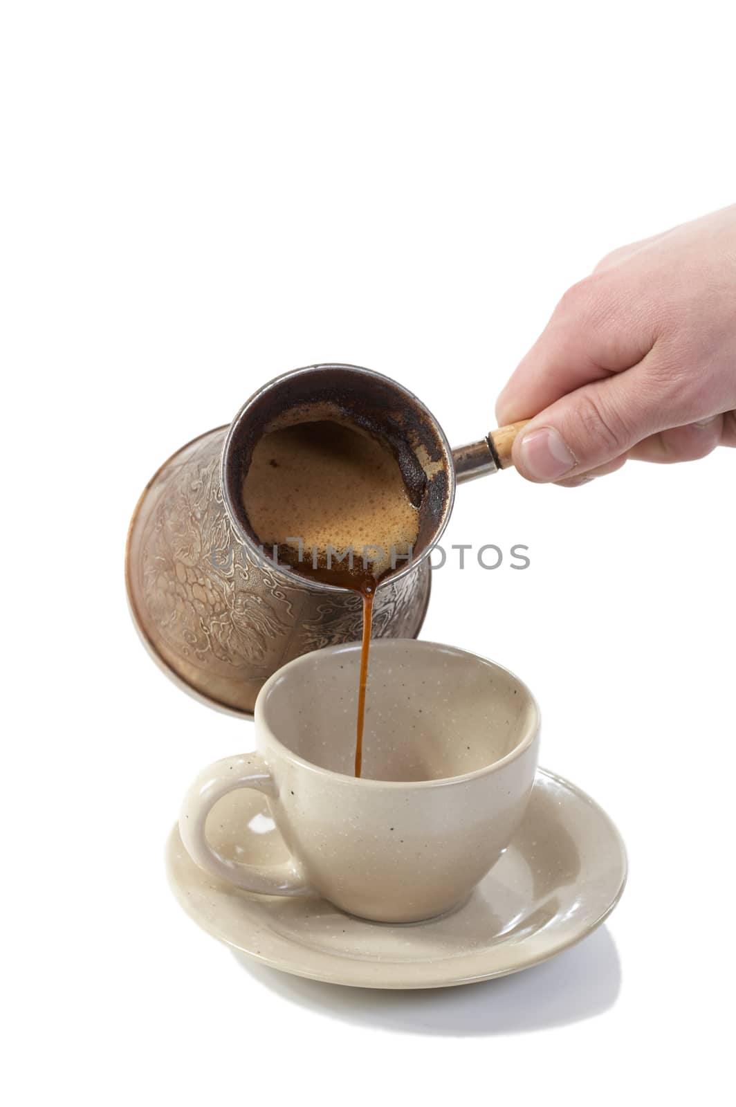 Coffee poured from coffee maker in cup on a white background