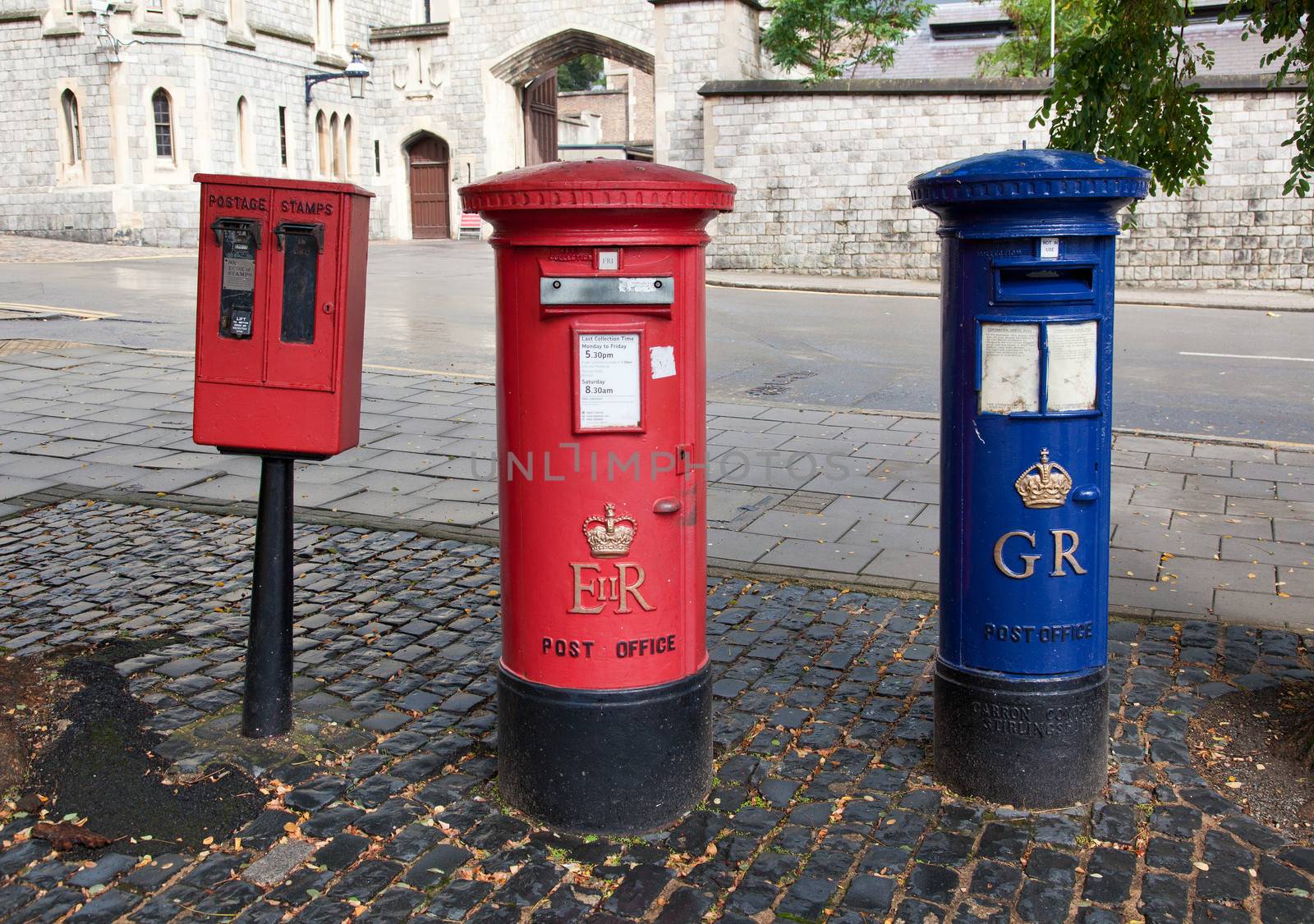 red British mail box on a city street