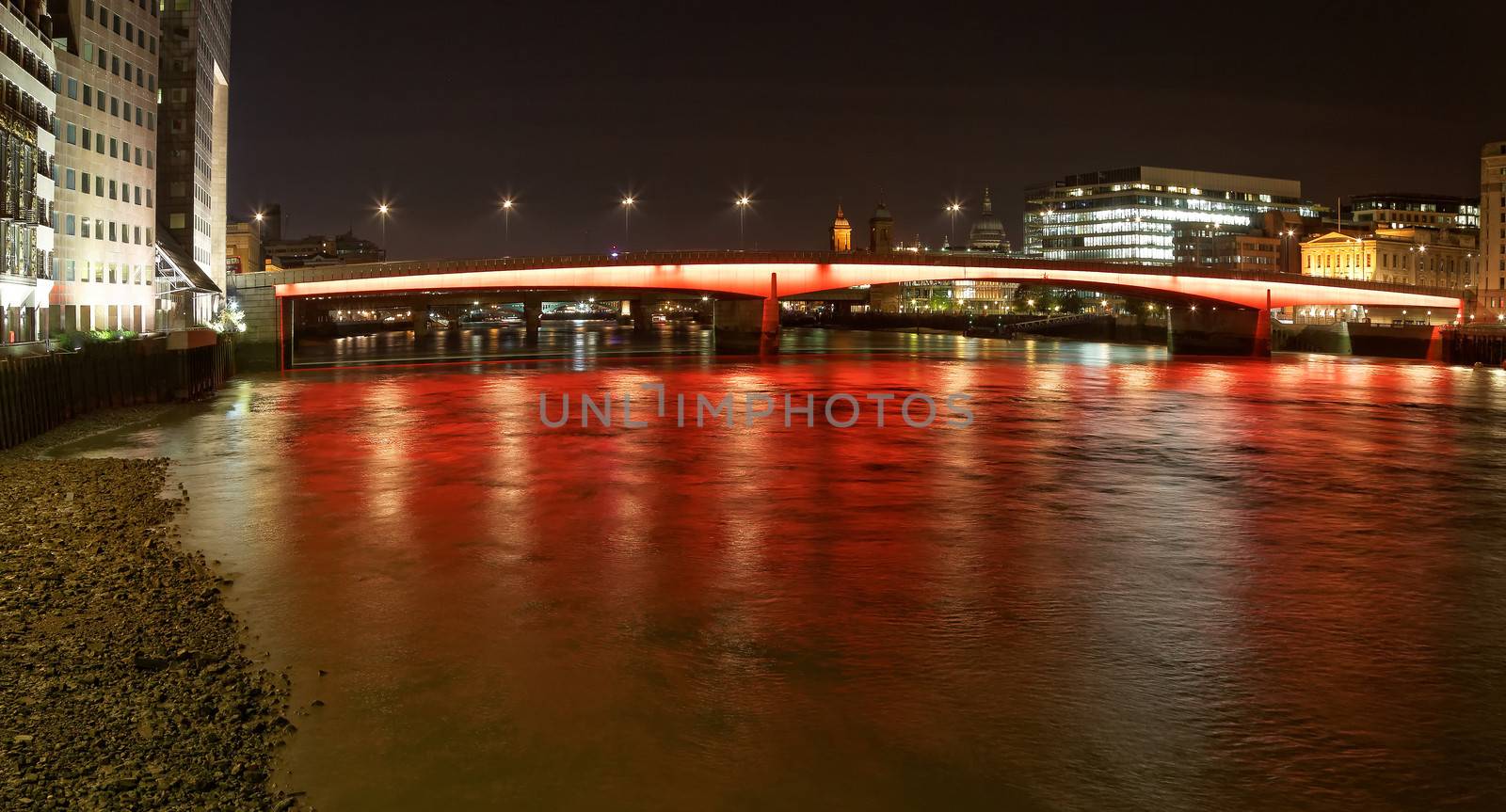 London Bridge with red and orange lights at night by gary718