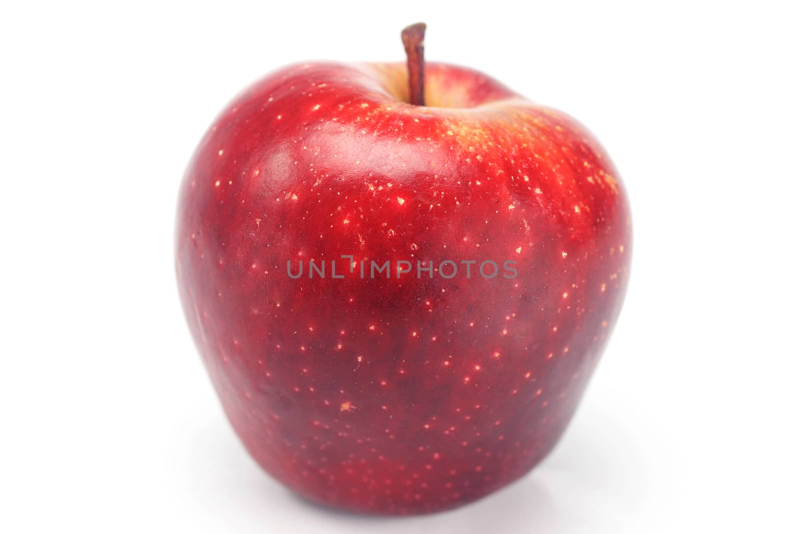 juicy red apple isolated on white by jannyjus
