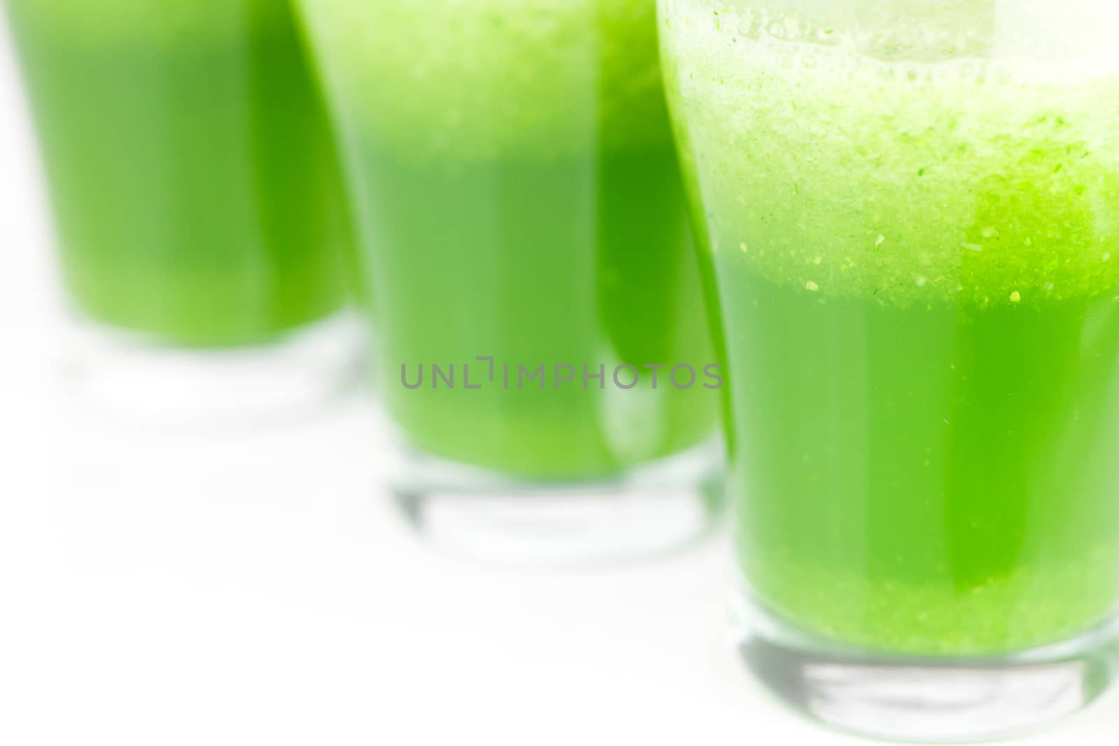 three glasses with celery juice isolated on white by jannyjus