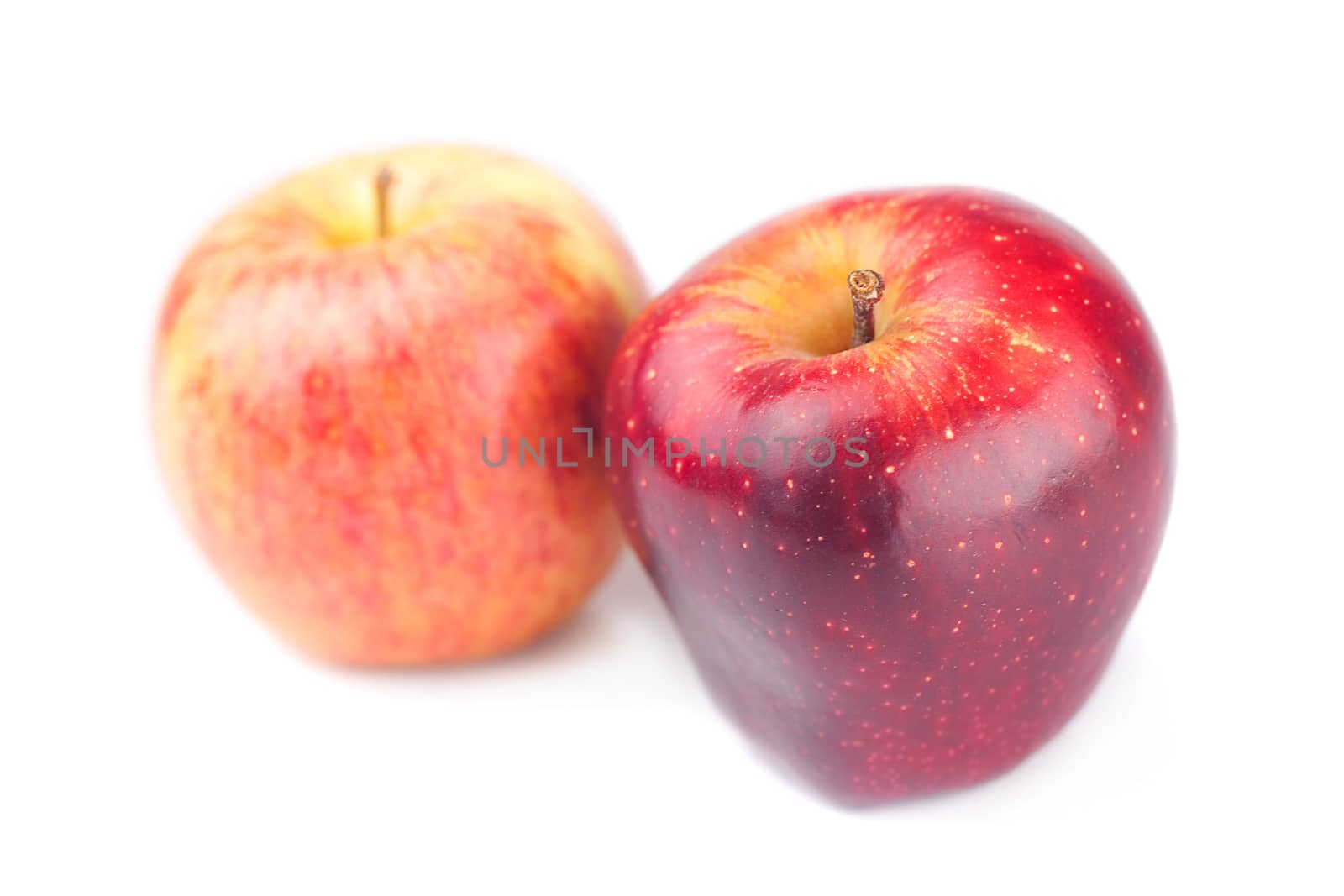 two juicy red apples isolated on white by jannyjus