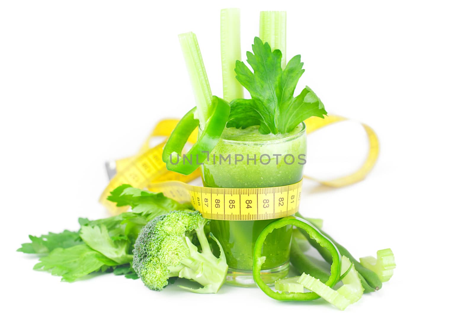 measuring tape,broccoli,pepper,celery and glass with celery juic by jannyjus