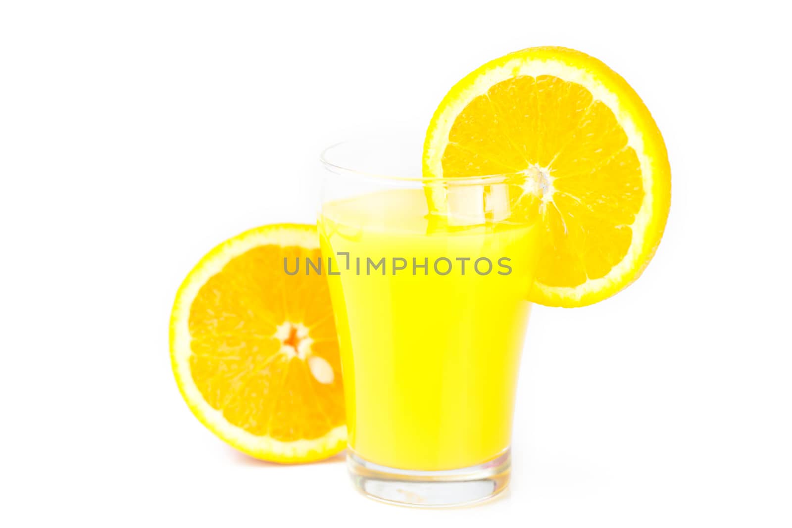 orange and a glass of orange juice isolated on white by jannyjus