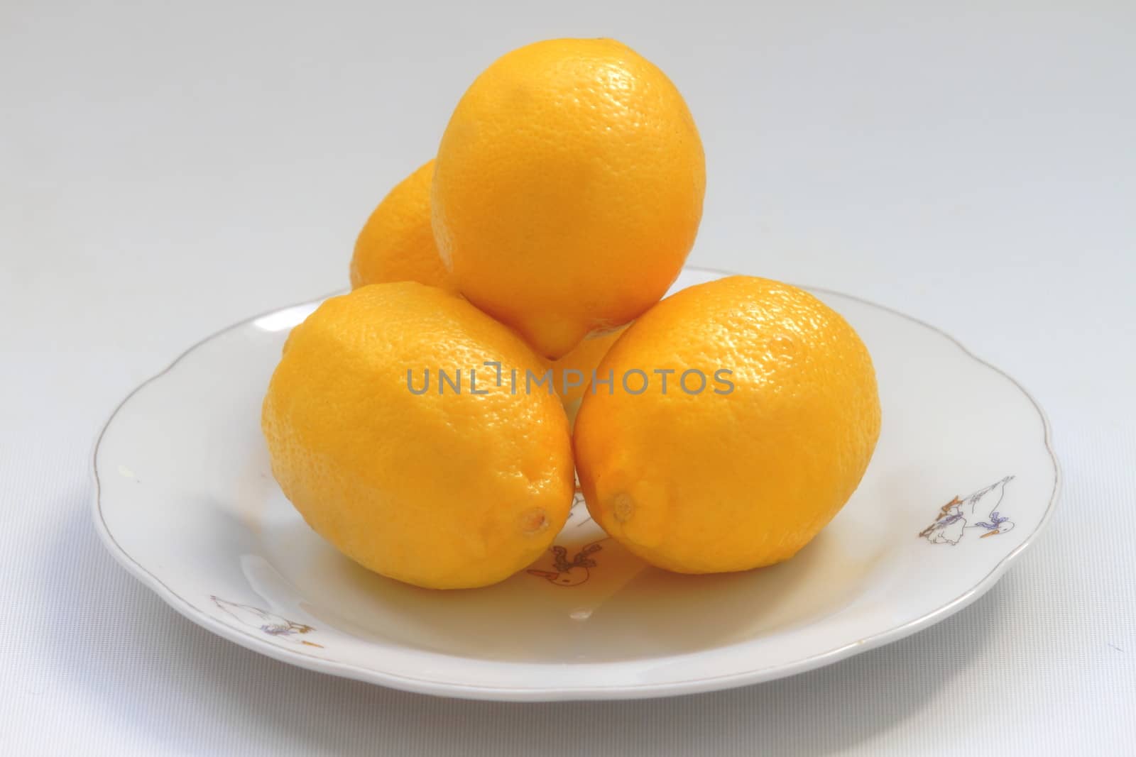 lemons on a plate by victorych