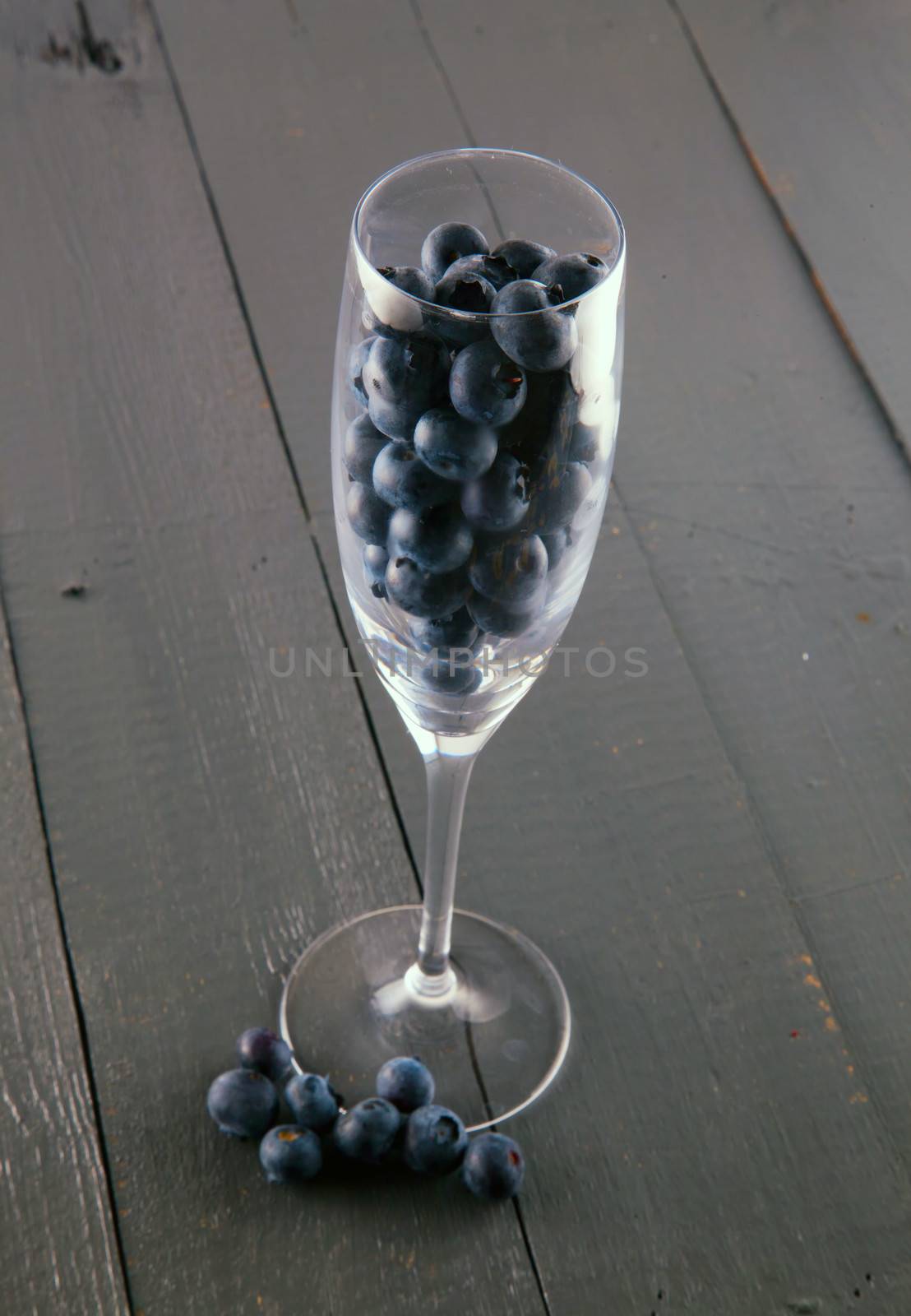 Entire view of a glass full of blueberries