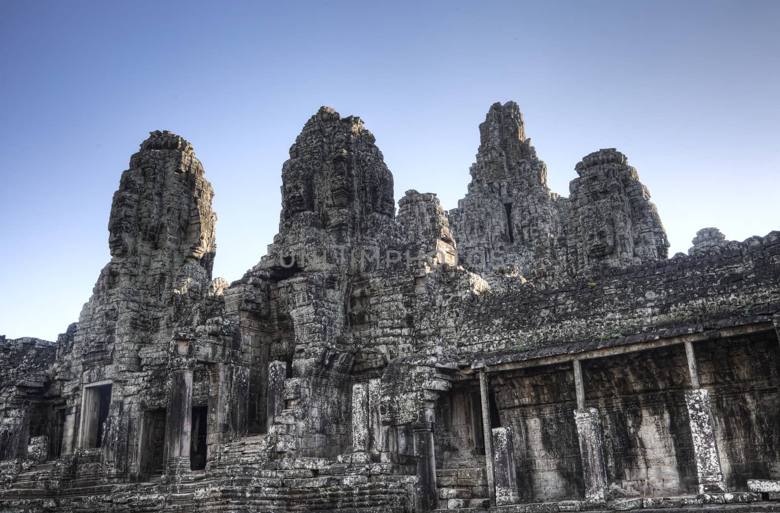 Eastern side  of Bayon temple at dusk  in Angkor Thom Cambodia. Bayon temple was built late 12th century under Jayavarman VII