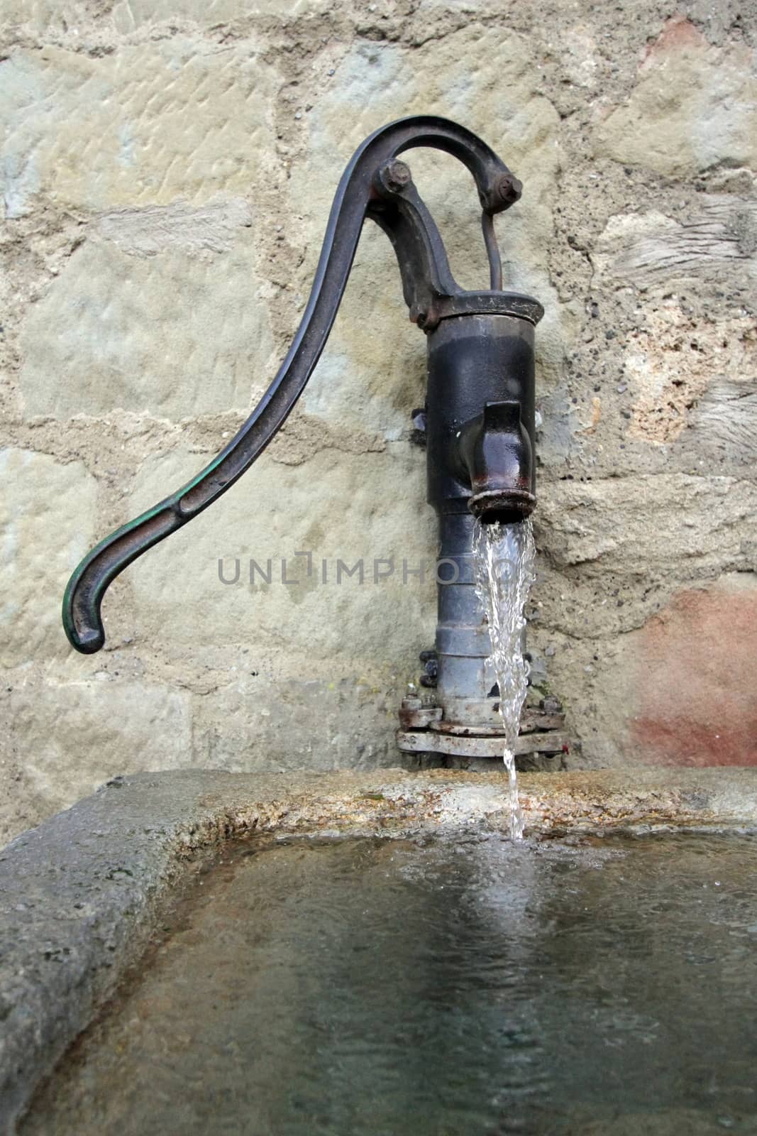 Close up on old fountain spout at castle of Chenaux in Estavayer-le-lac, Switzerland