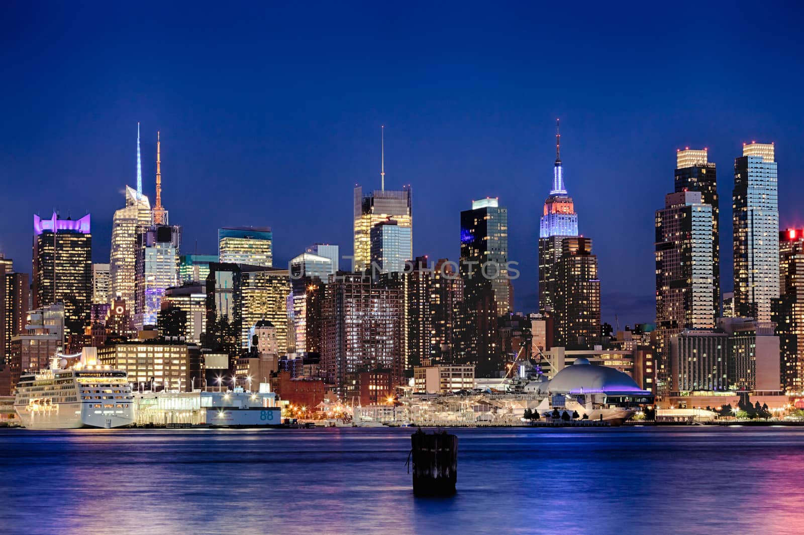 The New York City Uptown w Intrepid sea, air and space museum in the night