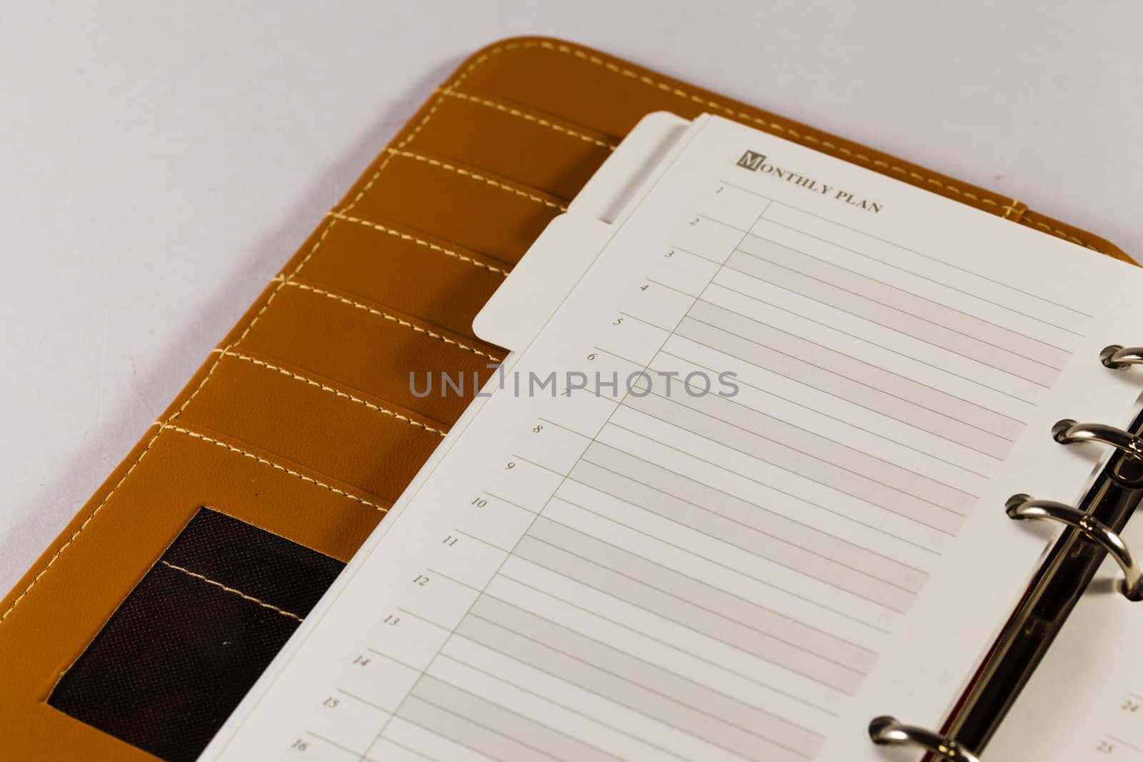 Close up image of black note book organizer against white backgr by thanomphong