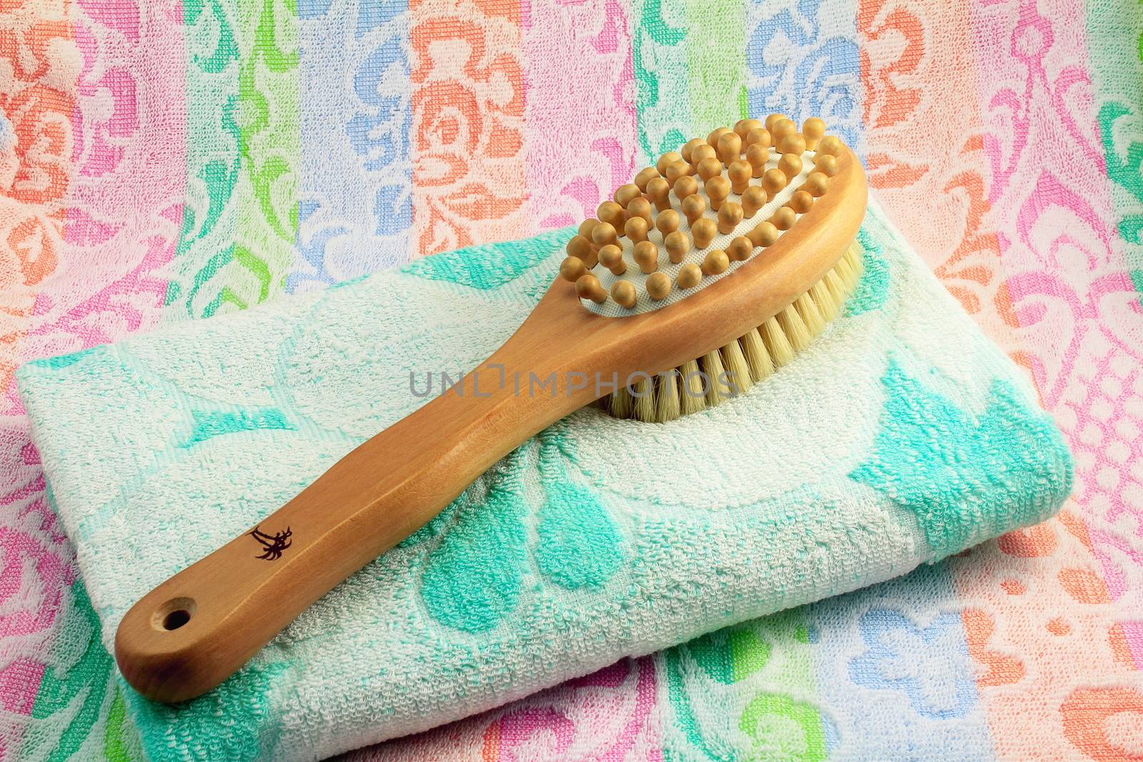 Wooden brush with the handle for massage of a body and a towel. by georgina198