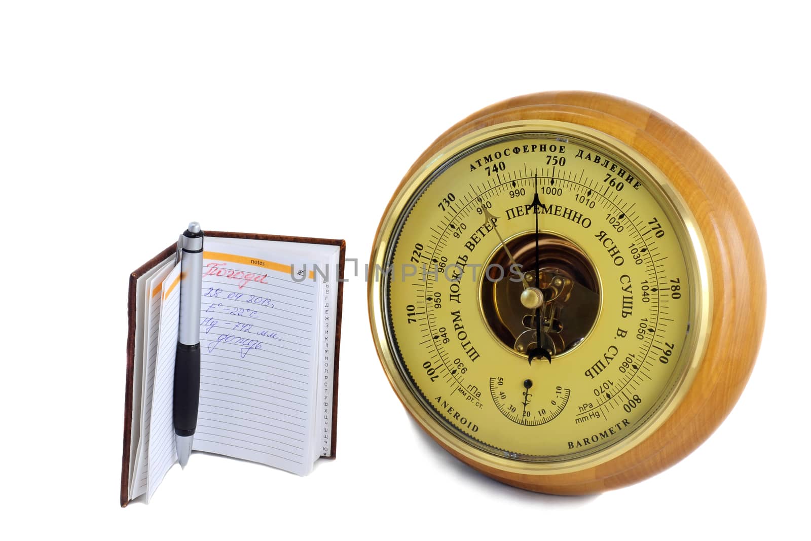 Barometer - aneroid and the notebook on a white background by georgina198