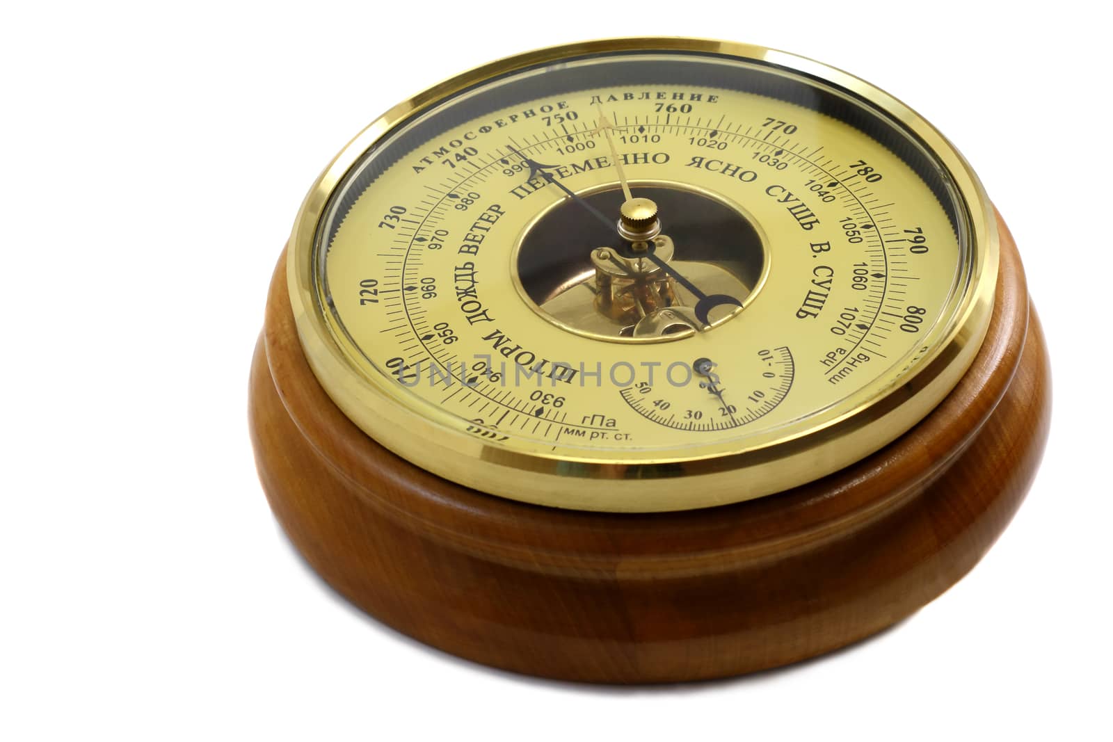 Barometer in the frame of wood . Presented on a white background.