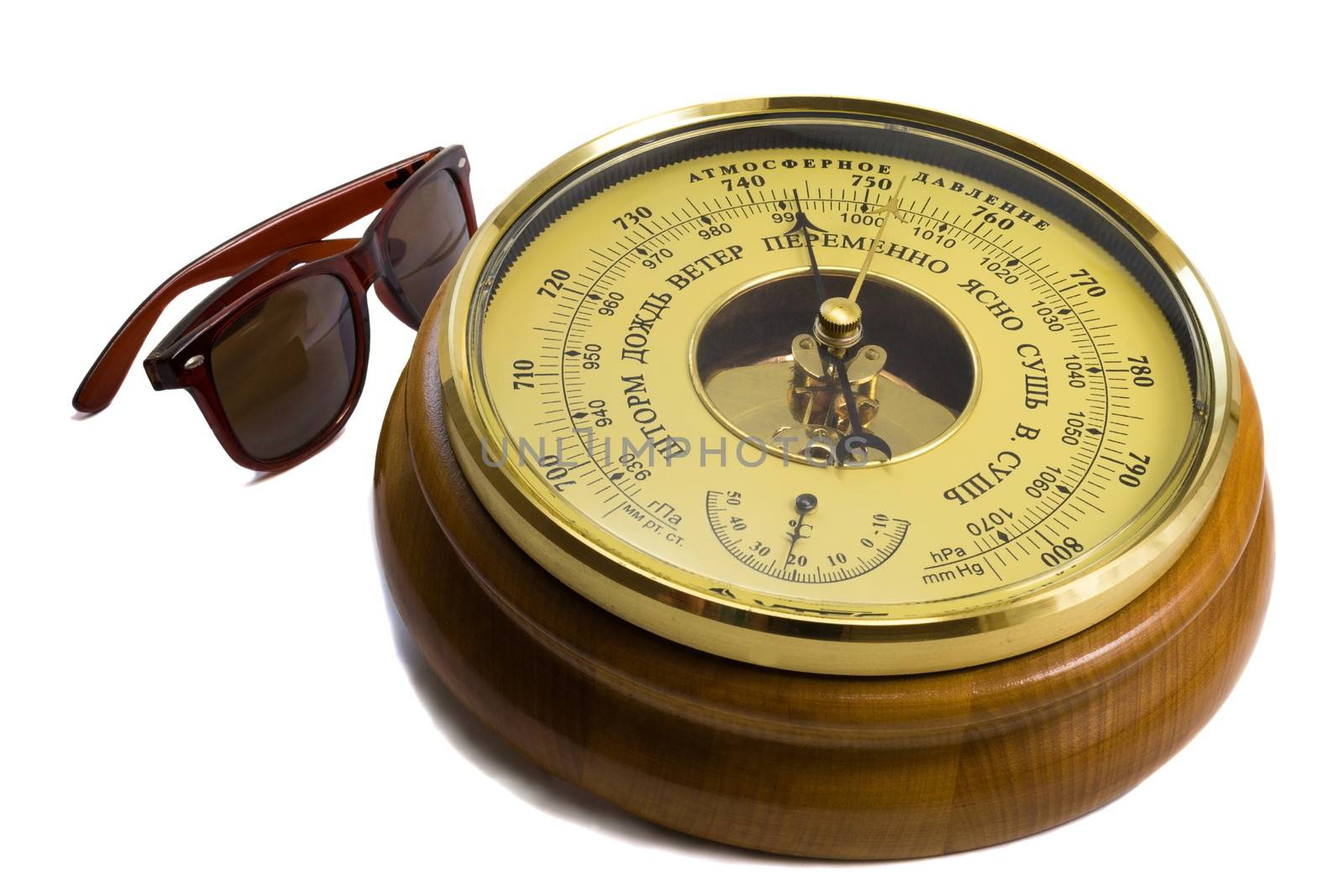 Barometer - aneroid on a white background and black sunglasses by georgina198