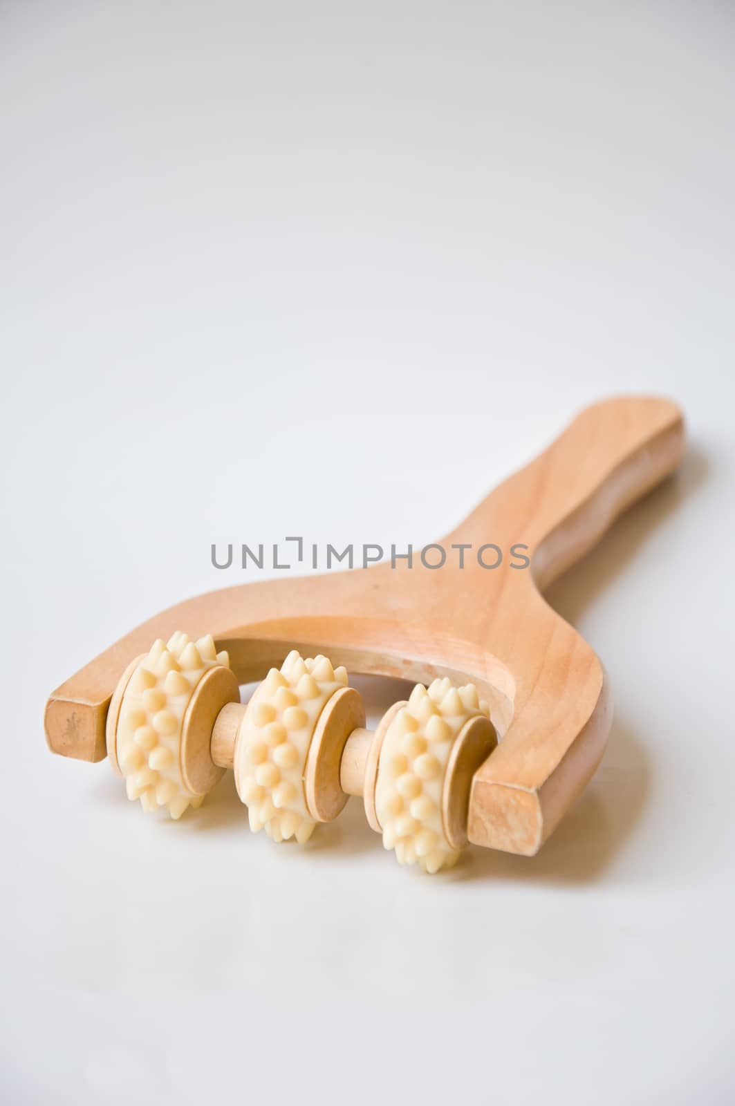 wood tool for massage on white background