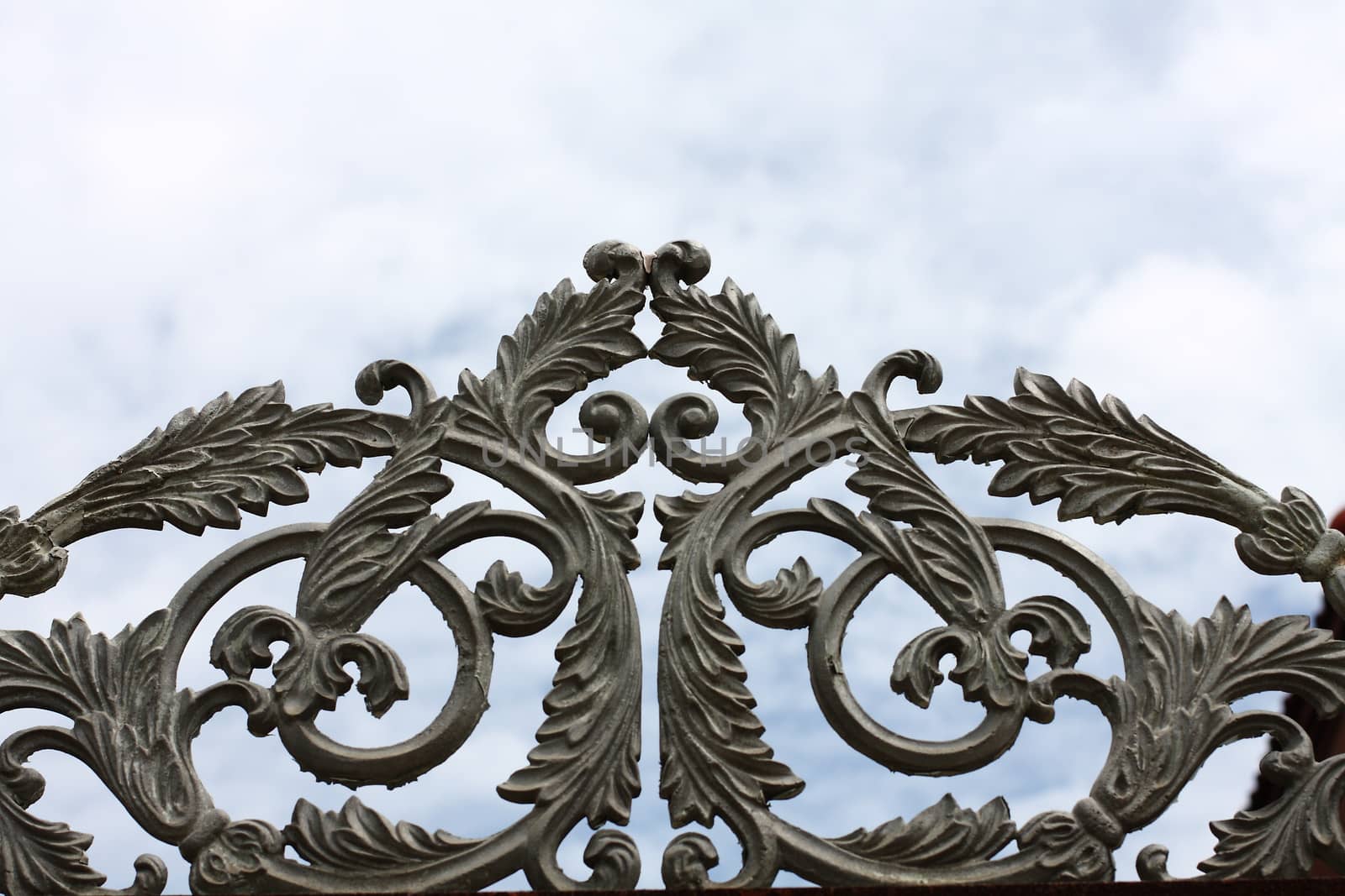 wrought iron gate on blue sky