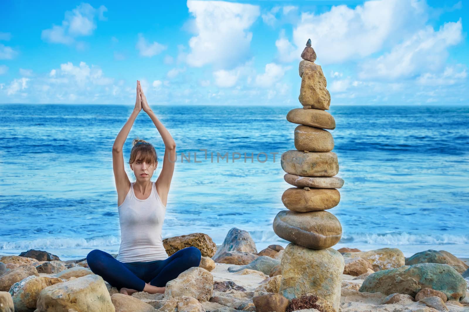 Yang woman practicing yoga by the ocean  by EllenSmile
