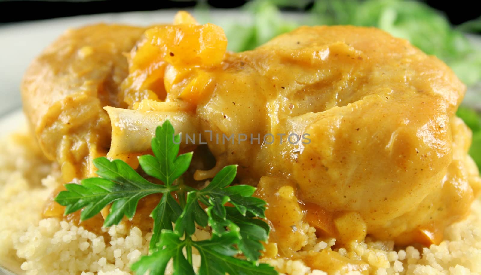 Apricot chicken drumsticks with a green side salad.