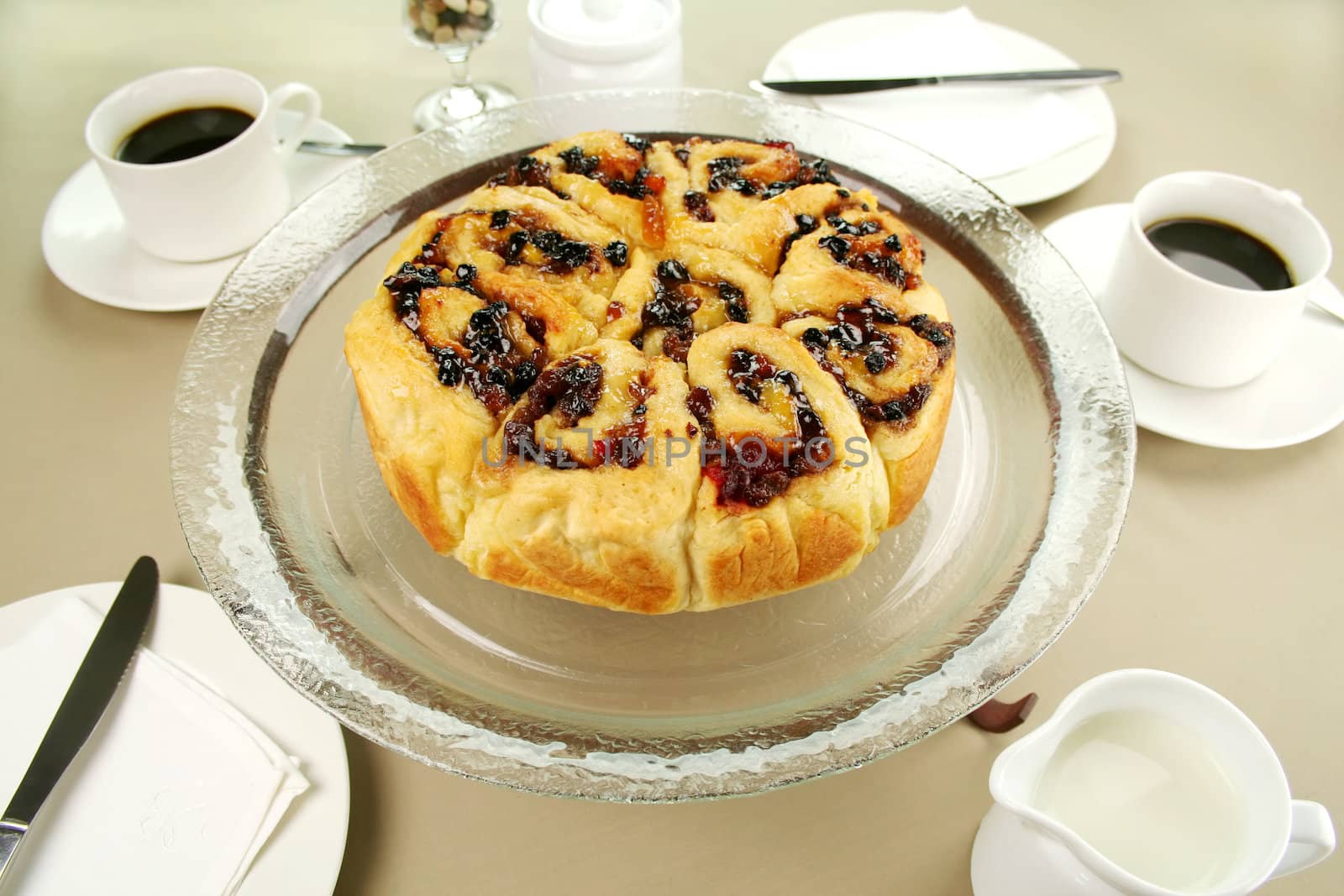 Delicious chelsea bun with dried fruit served with coffee