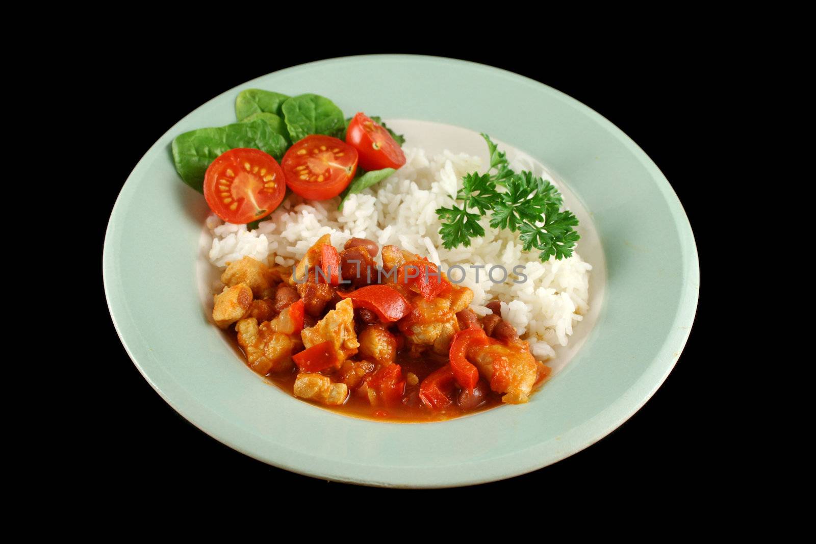 Spicy chicken lentil and pepper stew with rice and a fresh garden salad.