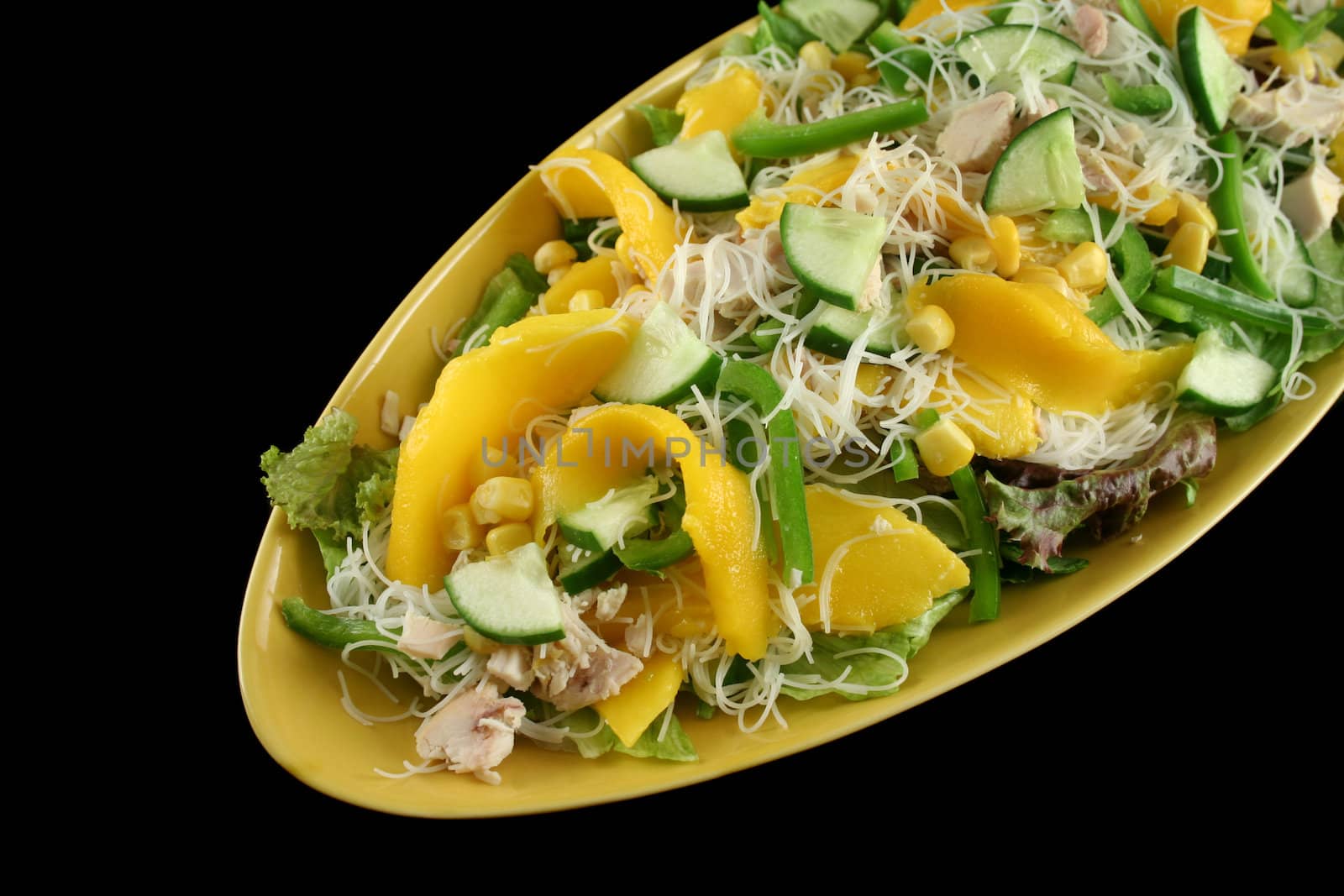 Delicious and colorful chicken, mango and noodle salad.