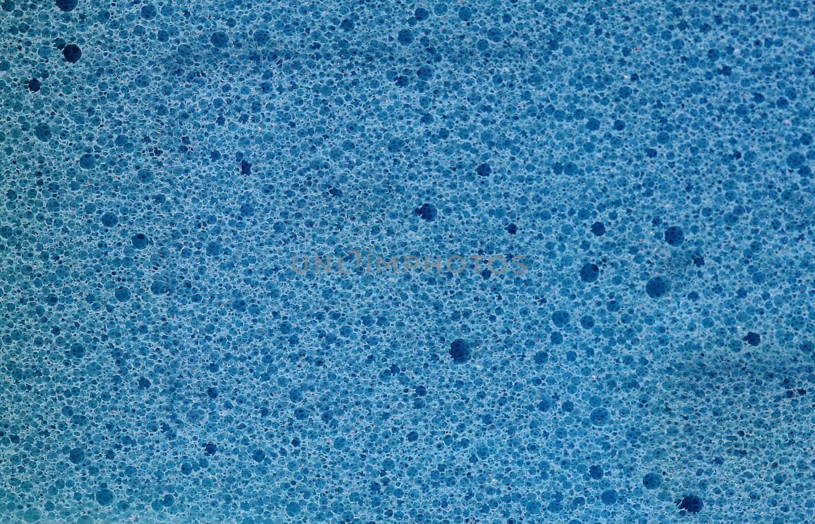 Closeup blue sponge texture background by myrainjom01