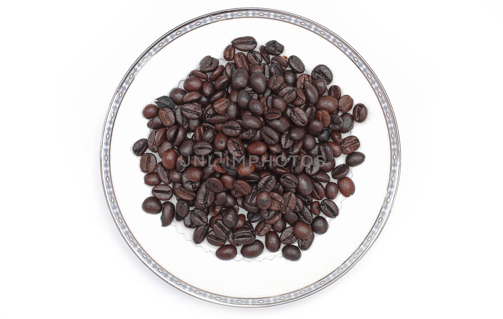 Coffee beans in a glass on a white background.