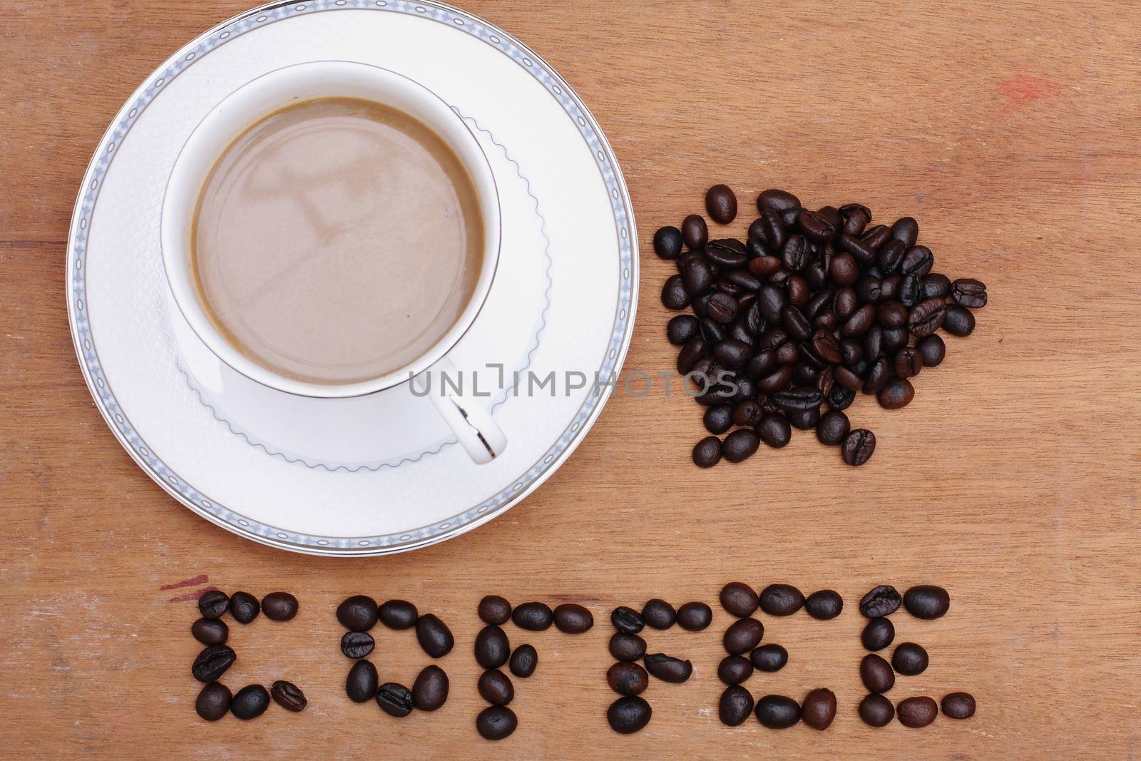 Coffee beans with coffee. wood background by myrainjom01