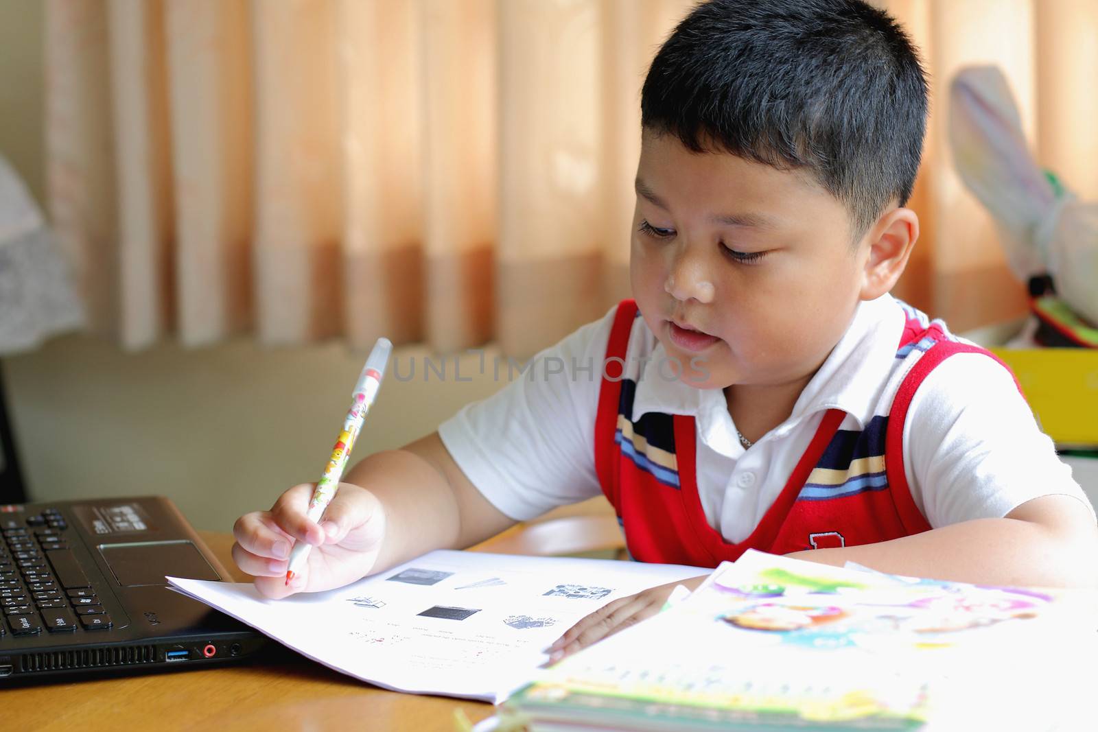 The boy work homework carefully. by myrainjom01