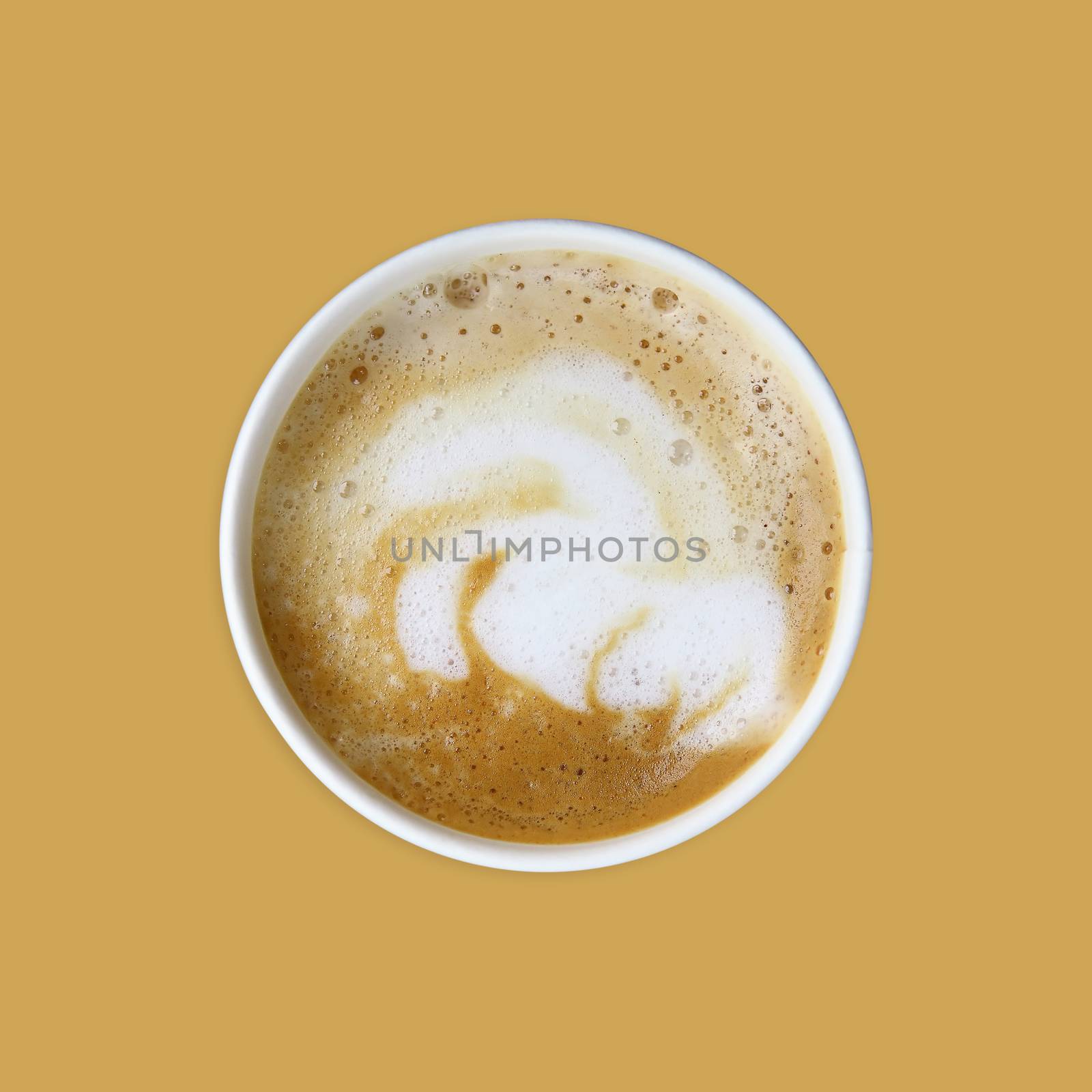 white cup of cappuccino on a beige background top view 