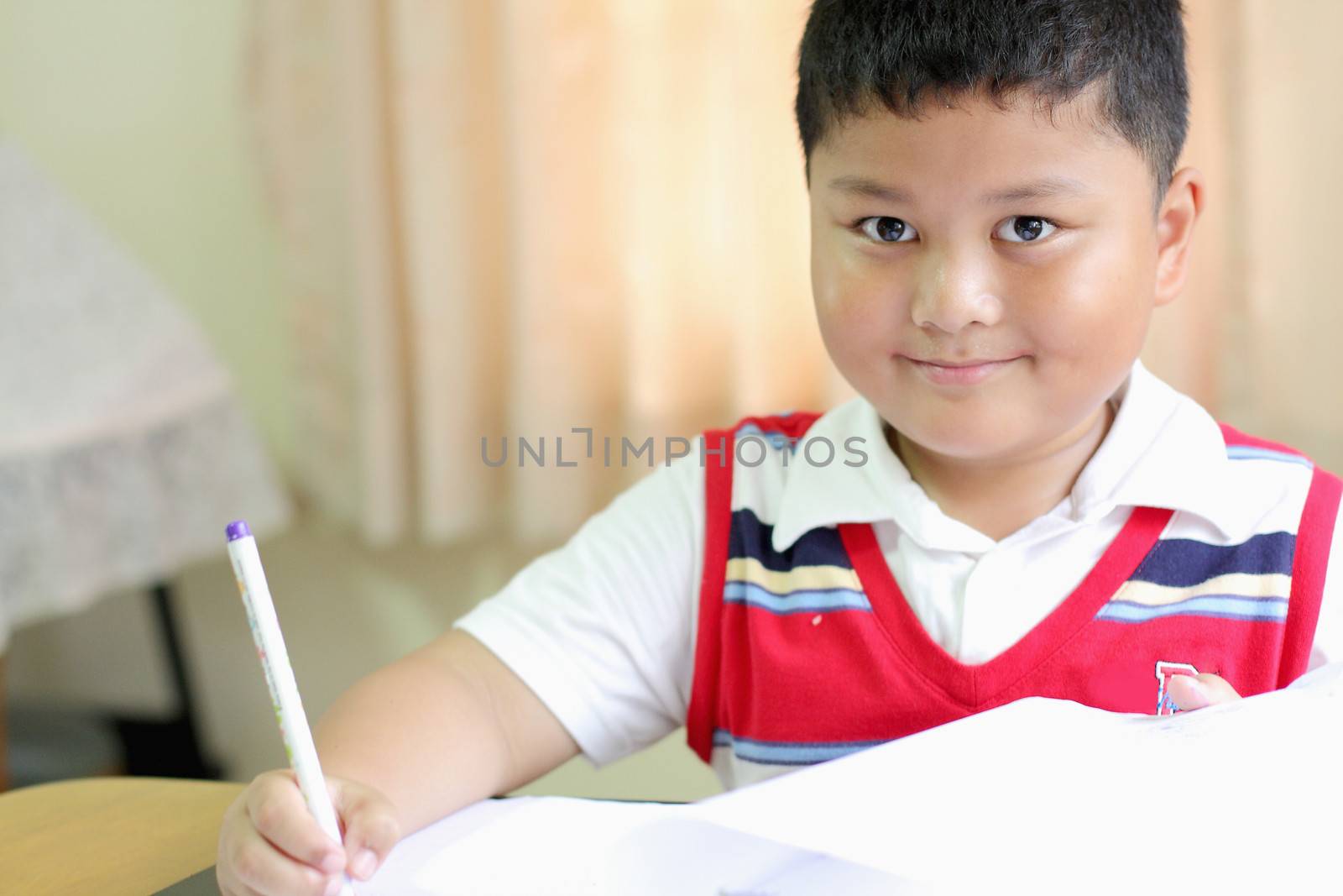 checking documents The boy intently.