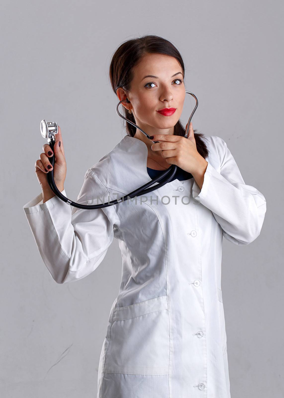 Woman doctor in a white coat with a stethoscope