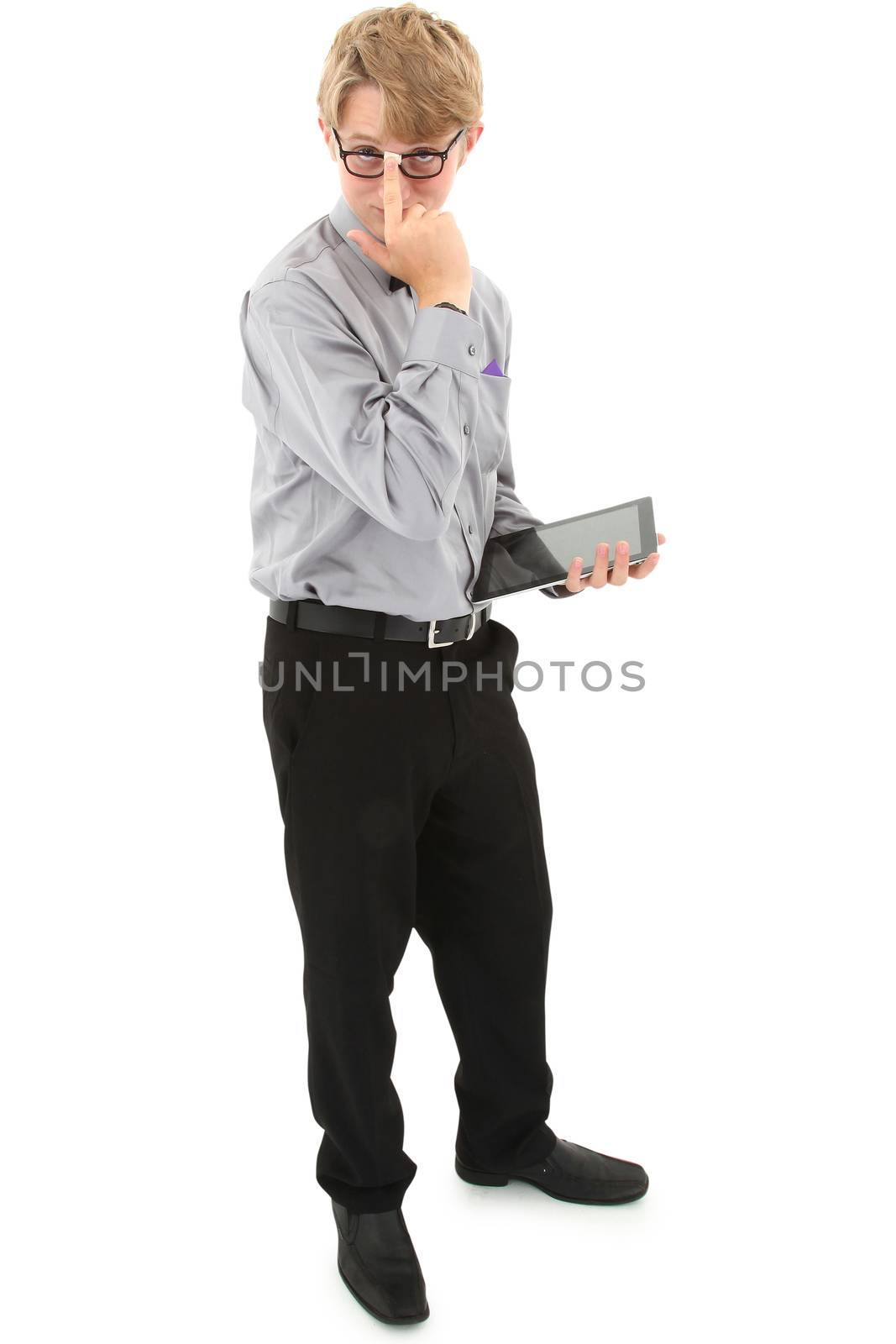 Geeky nerd teen with electronic notepad over white with clipping path. 