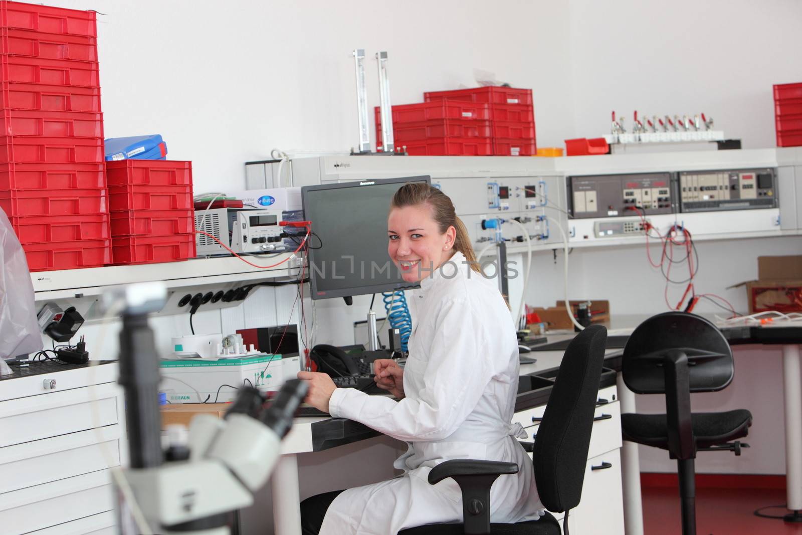 Confident female laboratory technician by Farina6000